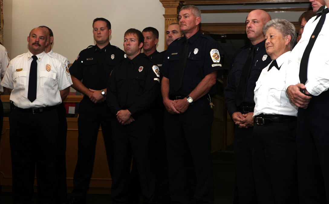 Members of Marine Corps Base Camp Lejeune’s Fire and Emergency Services Department watch as Brig. Gen. Thomas A. Gorry, commanding general of Marine Corps Installations East – MCB Camp Lejeune, presents the department with its award for achieving national accreditation. Earning national accreditation is an honor for fire stations across the country and speaks volumes on the quality of work the department exemplifies while doing its job. (Official Marine Corps photo by Lance Cpl. Scott W. Whiting) 