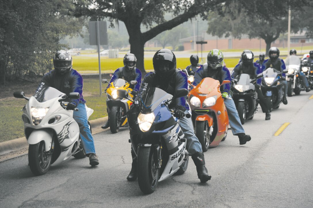 With headlights on to show support of domestic violence awareness, motorcyclists ride to Marine and Family Program’s building as part of Marine Corps Logistics Base Albany’s Domestic Violence Awareness Month Motorcycle Ride and Proclamation Signing Ceremony, Oct. 4.
