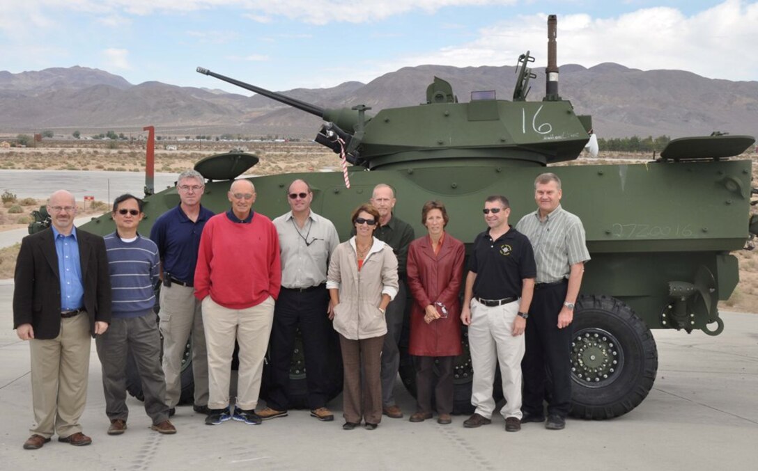 Students and staff from the Defense Acquisition University, Aberdeen Proving Ground, Md., stand next to a light armored vehicle at the test track aboard MCLB Barstow's Yermo Annex, Oct. 10. The students are in a 10-month program, learning everything from acquisition procedures to effective leadership. Their visit to the High Desert included MCLB Barstow and NTC Fort Irwin, Calif. Photo by: Gunnery Sgt. Reina Barnett
