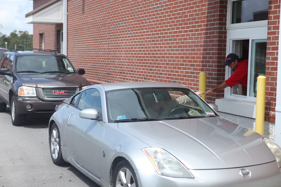 Vehicles go through Mess Hall 128’s drive-thru aboard Marine Corps Base Camp Lejeune. Mess Hall 128 earned a nomination for the Gen. W.P.T. Hill Award. The drive-thru is the first in a Department of Defense facility. 