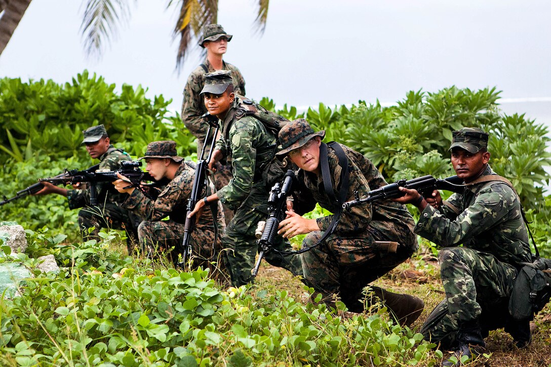 GAN, Republic of Maldives - Marines with Marine Deployment Unit 5 of the Maldivian National Defense Force and U.S. Marines with Company A, 1st Battalion, 4th Marine Regiment, conduct accountability training here Oct. 9 as part of Exercise Coconut Grove 2012. Coconut Grove is a bilateral training exercise conducted bi-annually between the U.S. Marine Corps and the MNDF.