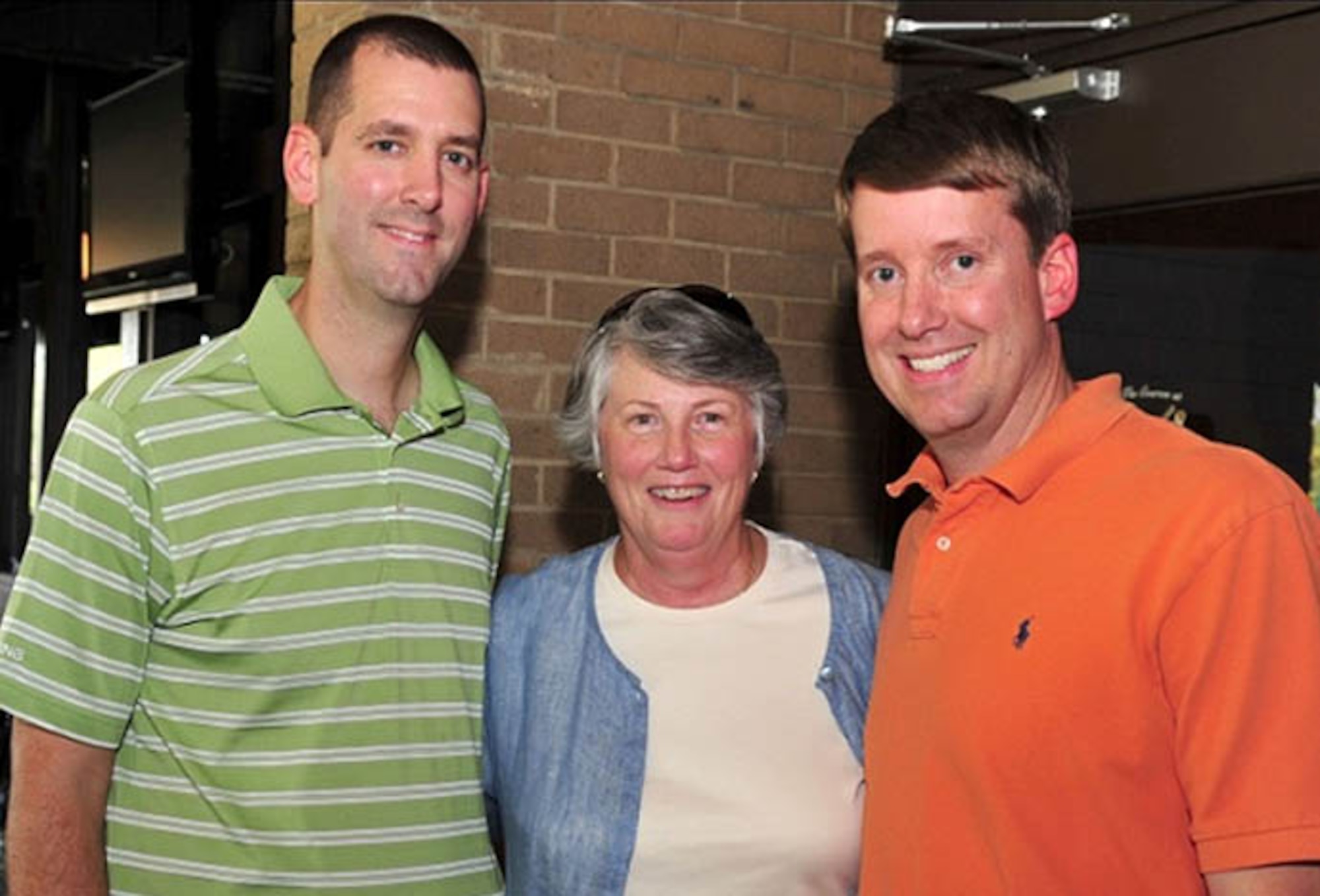 (Left) Col. David DuHadway, Air Force District of Washington director of staff, his brother Jay and their stepmother Donna DuHadway continue the legacy of helping others ? a quality instilled by their father and husband, Thomas E. DuHadway, former Federal Bureau of Investigation assistant director ? during the DuHadway Golf Tournament Oct. 5 at Joint Base Andrews, Md. For the past 20 years the tournament at JBA has raised funds for the FBI's Washington Metropolitan Field Office special agents in a time of financial need. Thomas DuHadway, who died in 1991, was well known throughout the bureau for his selfless acts and love for life by helping others. (U.S. Air Force photo by Senior Airman Steele C. G. Britton)