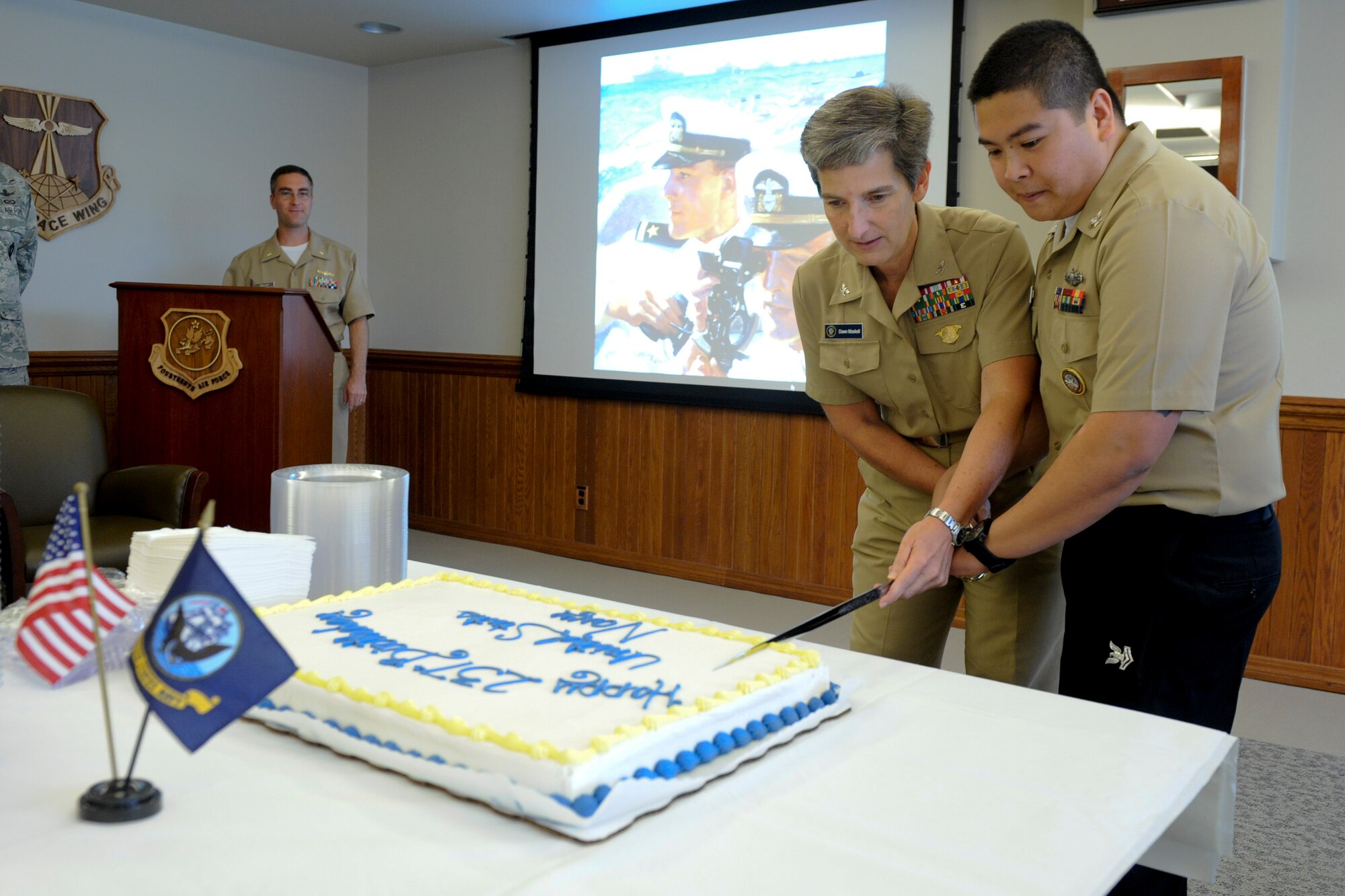 VANDENBERG AIR FORCE BASE, Calif. -- Capt. Dawn Maskell, the Joint Functional Component Command for Space chief of staff, and Petty Officer 2nd Class Glennaldrin Mupas, a 614th Air Operations Center member, cut the birthday cake during the U.S. Navy's 237th Birthday celebration here Friday, Oct 12, 2012. Currently a modern force of 287 ships and more than 3,700 aircraft, our Navy was created in 1775 with the establishment of the Continental Navy to sail against British merchant ships. (U.S. Air Force photo/Staff Sgt. Levi Riendeau)
