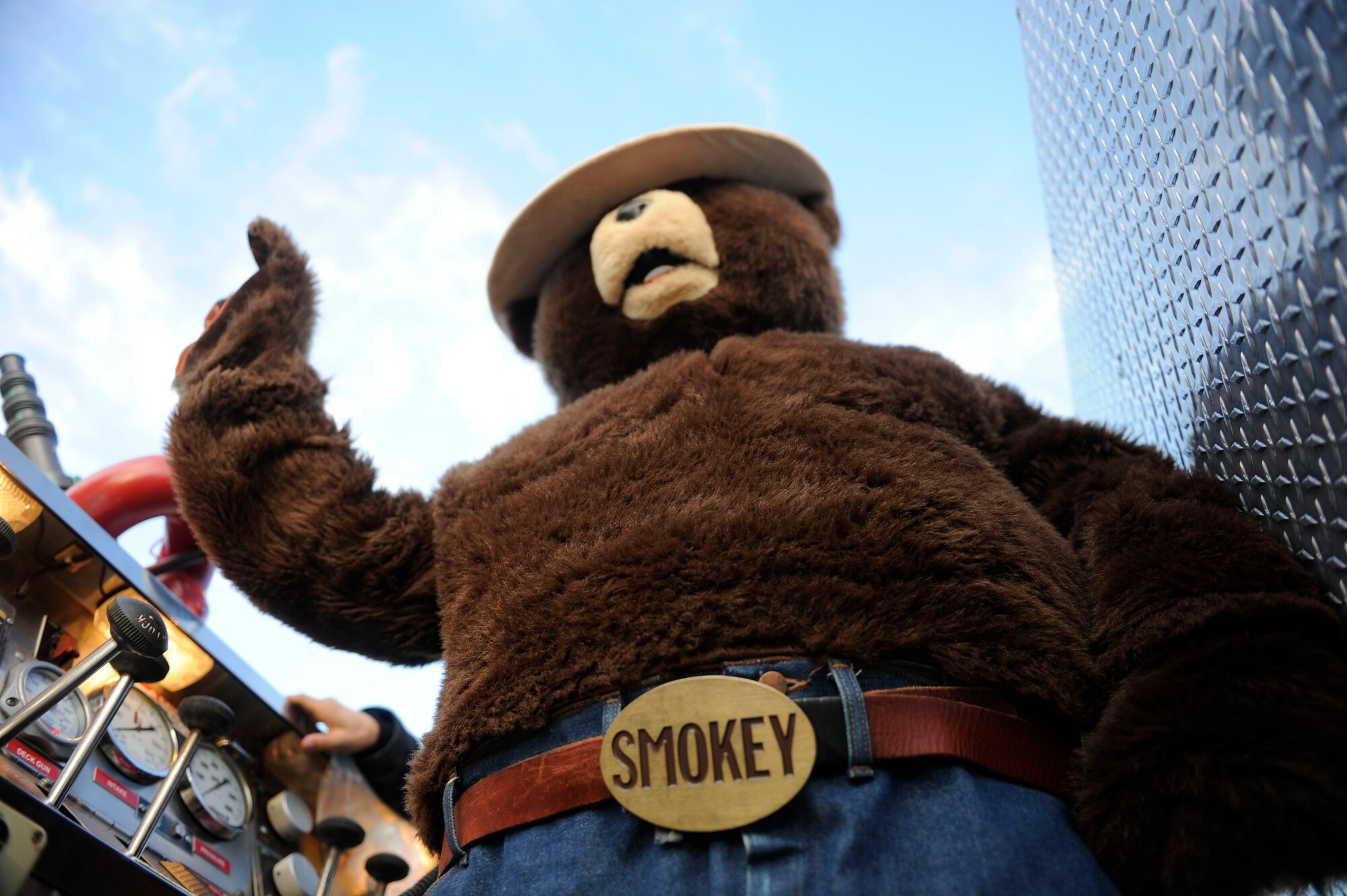 VANDENBERG AIR FORCE BASE, Calif. – Smokey Bear rides in the lead fire engine during a parade through base housing here Thursday evening, Oct. 11, 2012. The Fire Prevention Parade was one of the key events the Vandenberg Fire Department hosted during Fire Prevention Week Oct. 7-13. (U.S. Air Force photo/Airman Veronique Henry)