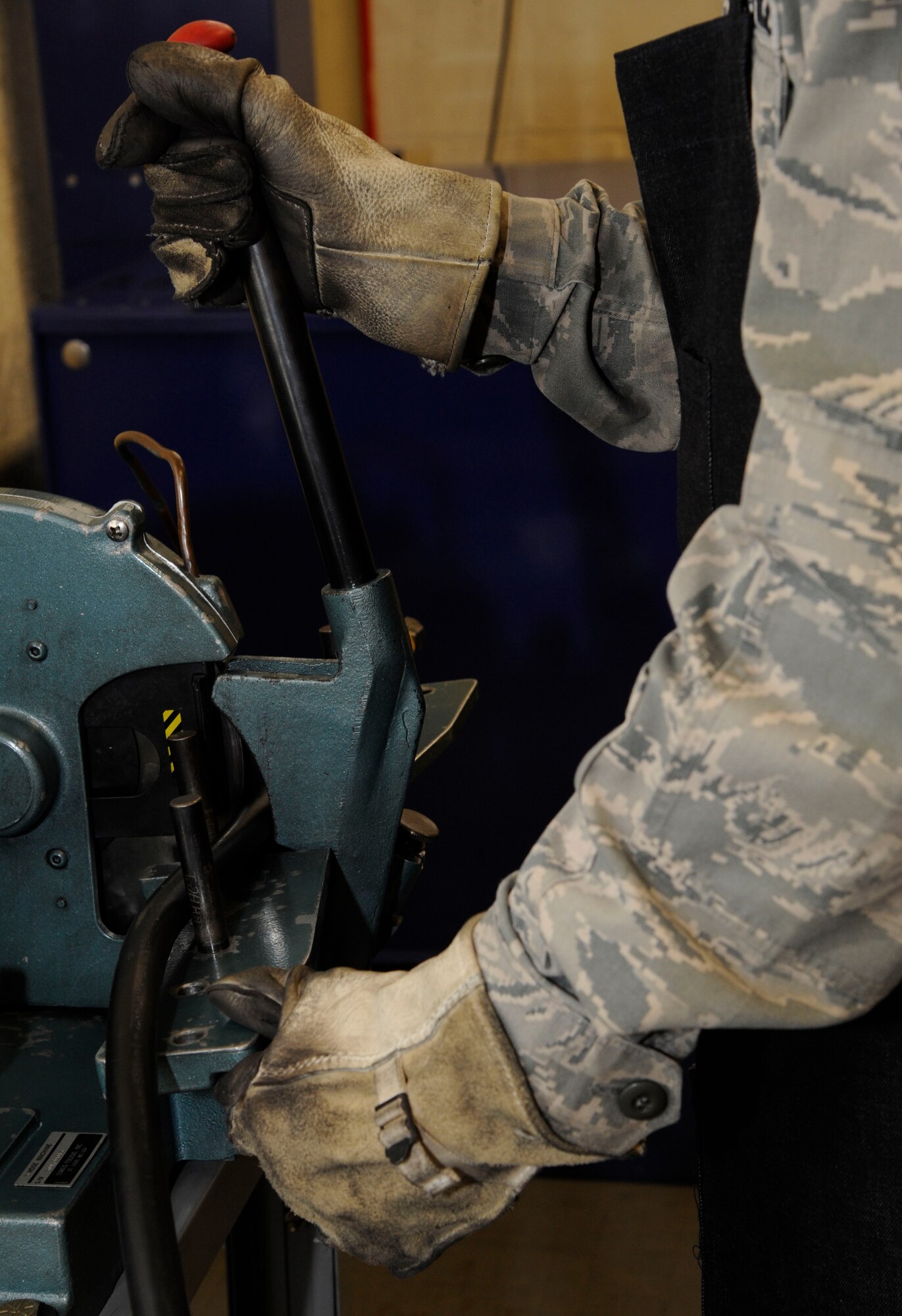 Senior Airman Richard Cota, 2nd Maintenance Squadron accessories flight hydraulics section, prepares to cut a hydraulic line on Barksdale Air Force Base, La., Oct. 9. The Airmen assigned to the hydraulics section are responsible for the maintenance of Barksdale's B-52H Stratofortress' hydraulic systems, which assist the aircraft in steering, landing and most importantly opening of the bomb-bay doors. (U.S. Air Force photo/Airman 1st Class Andrew Moua)(RELEASED)