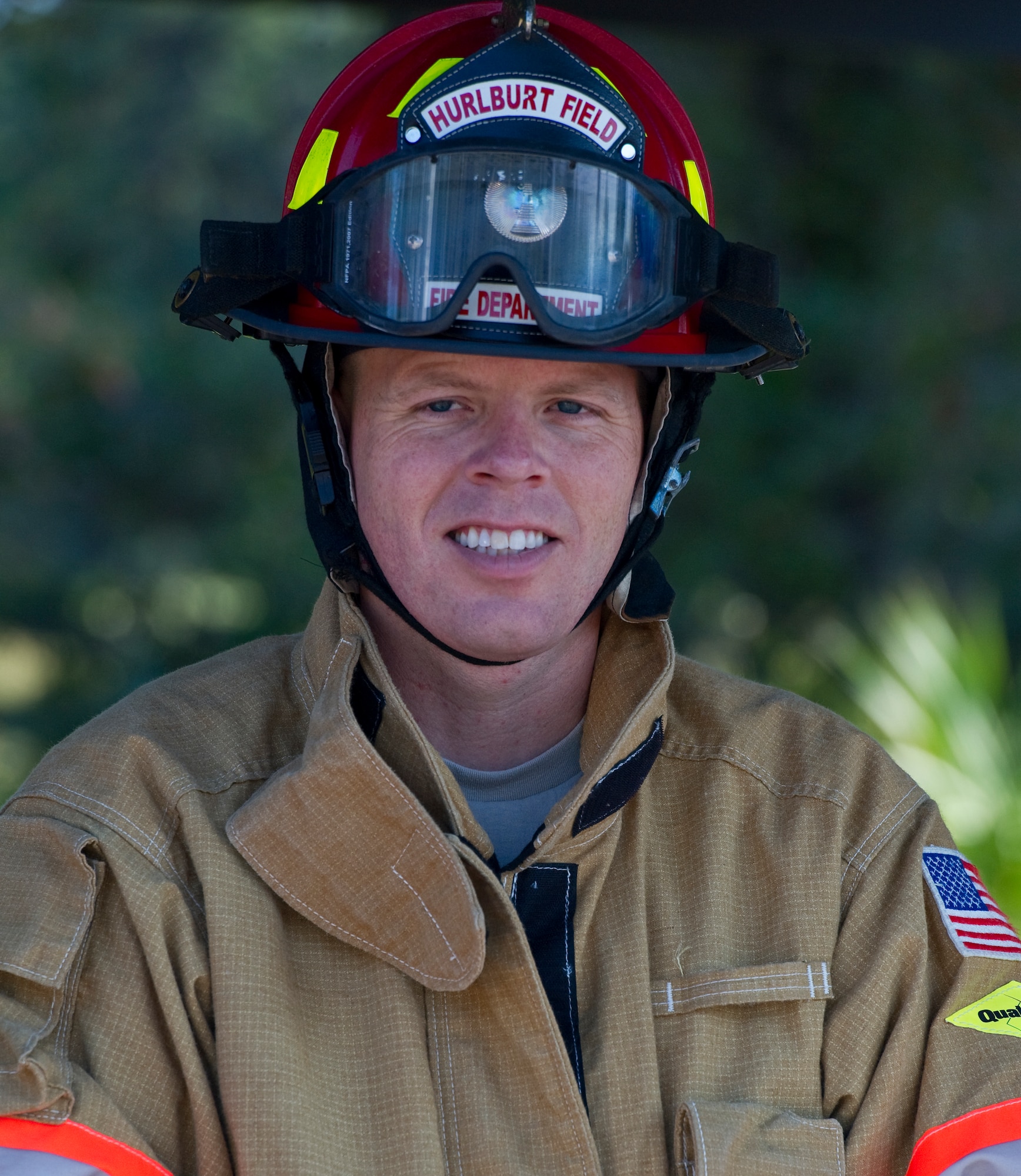 U.S. Air Force Lt. Col. Kirk Peterson, commander of 1st Special Operations Logistics Readiness Squadron, listens to the safety brief before firefighter training on Hurlburt Field, Fla., Oct. 11, 2012. The participants trained at three different stations, learning how to use the Jaws of Life, proper use of a fire hose, and using a vehicle-mounted water turret to extinguish a simulated C-130 crash site fire. (U.S Air Force photo/Airman 1st Class Christopher Williams)