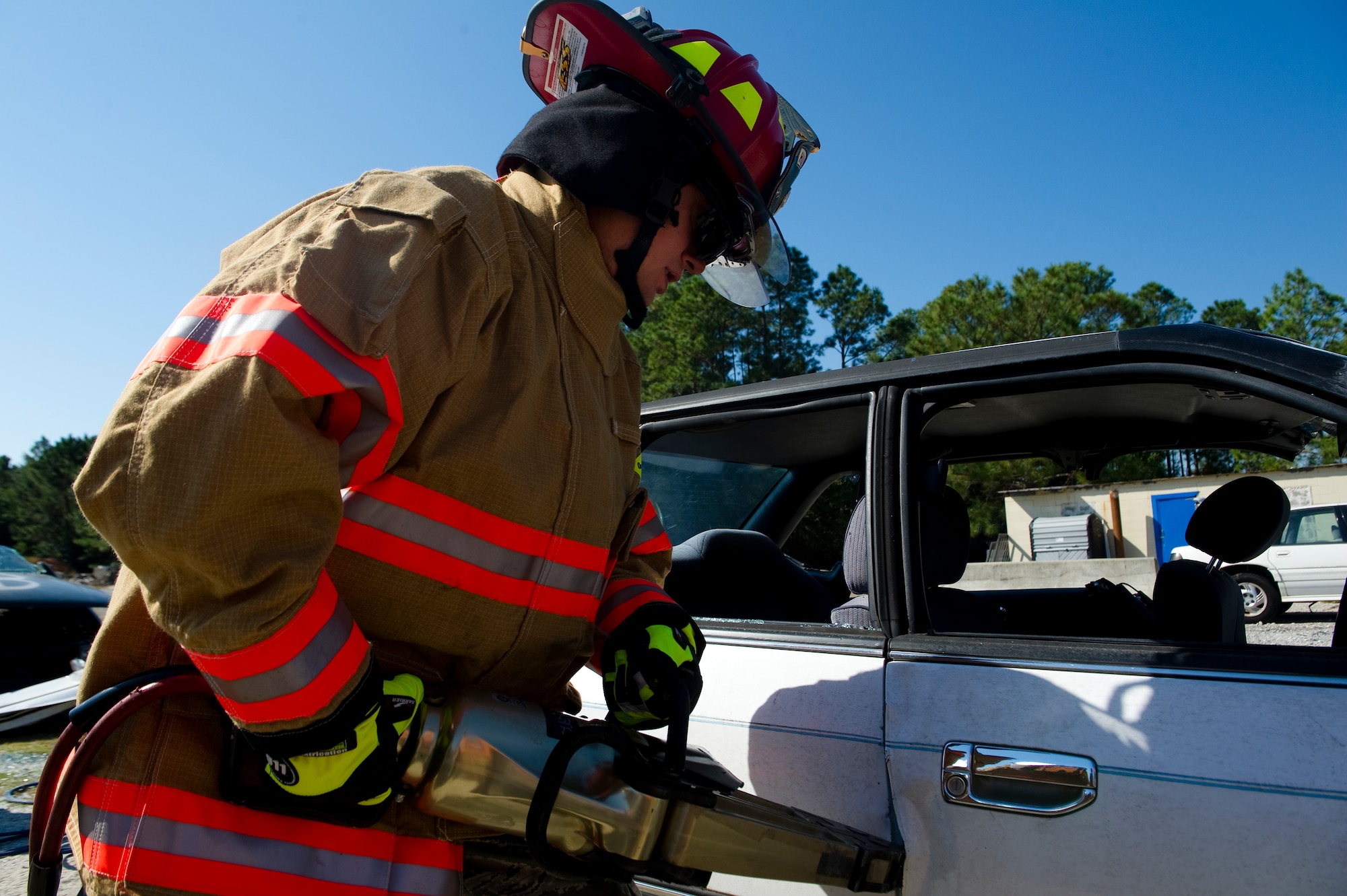 U.S. Air Force Col. Douglas Dudley, commander of 1st Special Operations Mission Support Group, uses the Jaws of Life to open a car door during firefighter training on Hurlburt Field, Fla., Oct. 11, 2012. The squadron leaders from the 1st SOMSG trained on how to perform a proper vehicle extraction. (U.S. Air Force photo/Airman 1st Class Christopher Williams)