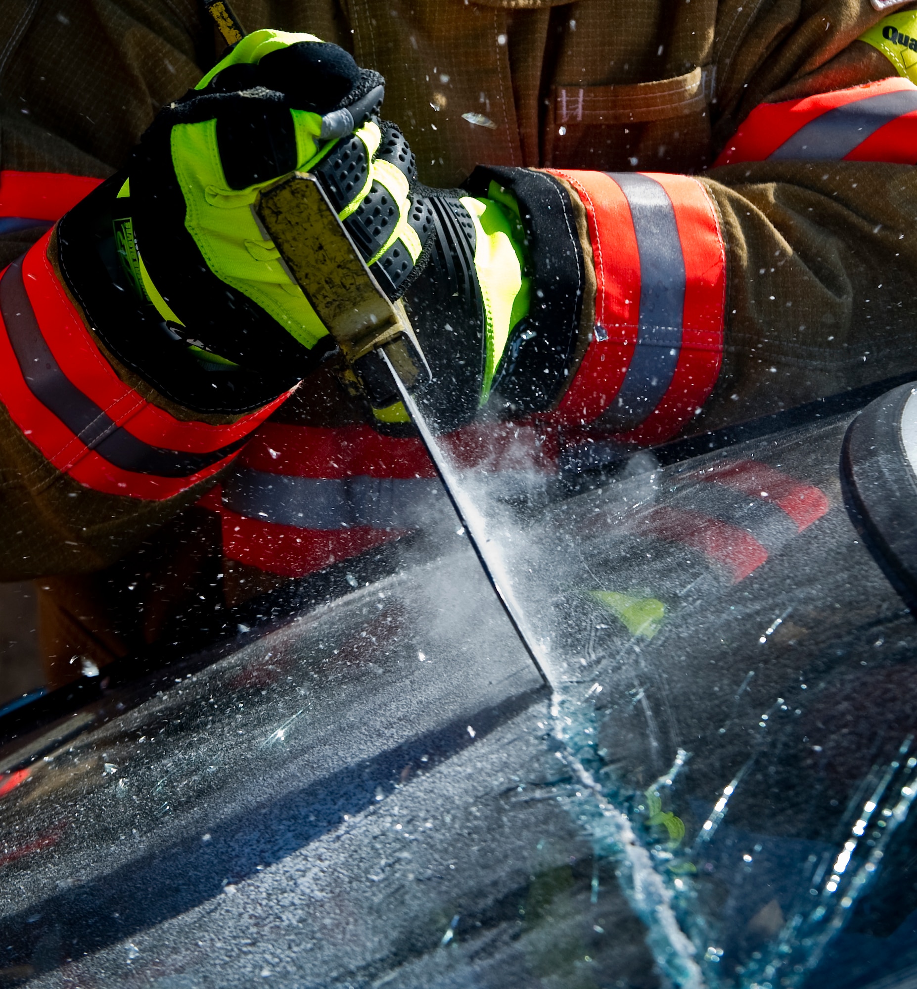 U.S. Air Force 1st Special Operations Mission Support Group squadron leadership learned proper glass cutting techniques during firefighter training on Hurlburt Field, Fla., Oct. 11, 2012. The vehicle extraction training had two parts: Jaws of Life and proper way to remove glass from a vehicle. (U.S. Air Force photo/Airman 1st Class Christopher Williams)