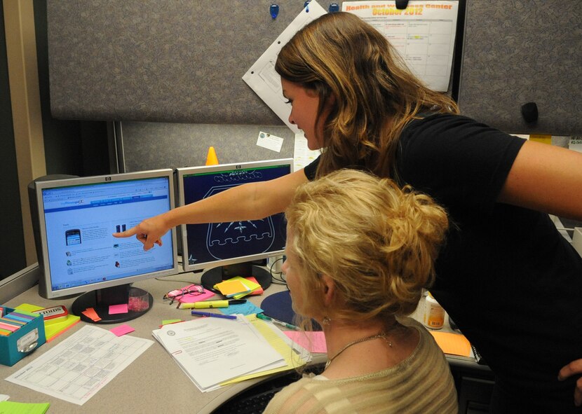 Leah Beckham, Health and Wellness Center health fitness specialist, shows Amanda Bowman, HAWC health promotion dietician, applications on My Fitness Pal on Barksdale Air Force Base, La., Oct. 12. The HAWC will be using My Fitness Pal to help track progress during their 2nd annual Beat the Bird challenge. Beat the Bird is a holiday challenge for Team Barksdale members to maintain a healthy weight and body composition over the holidays through exercise and healthy eating. (U.S. Air Force photo/Senior Airman Kristin High)(RELEASED)

