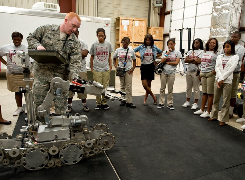 Senior Airman Timothy Ostberg, 2nd Civil Engineer Squadron Explosive Ordnance Disposal Flight, shows a bomb disposal robot to members of Booker T. Washington High School, Shreveport, La., Junior Reserve Office Training Corps during a tour of Barksdale Air Force Base, La., Oct. 12. Barksdale routinely hosts tours for recruiting purposes and to give civilians an inside view of how the base operates. (U.S. Air Force photo/Staff Sgt. Chad Warren)(RELEASED)