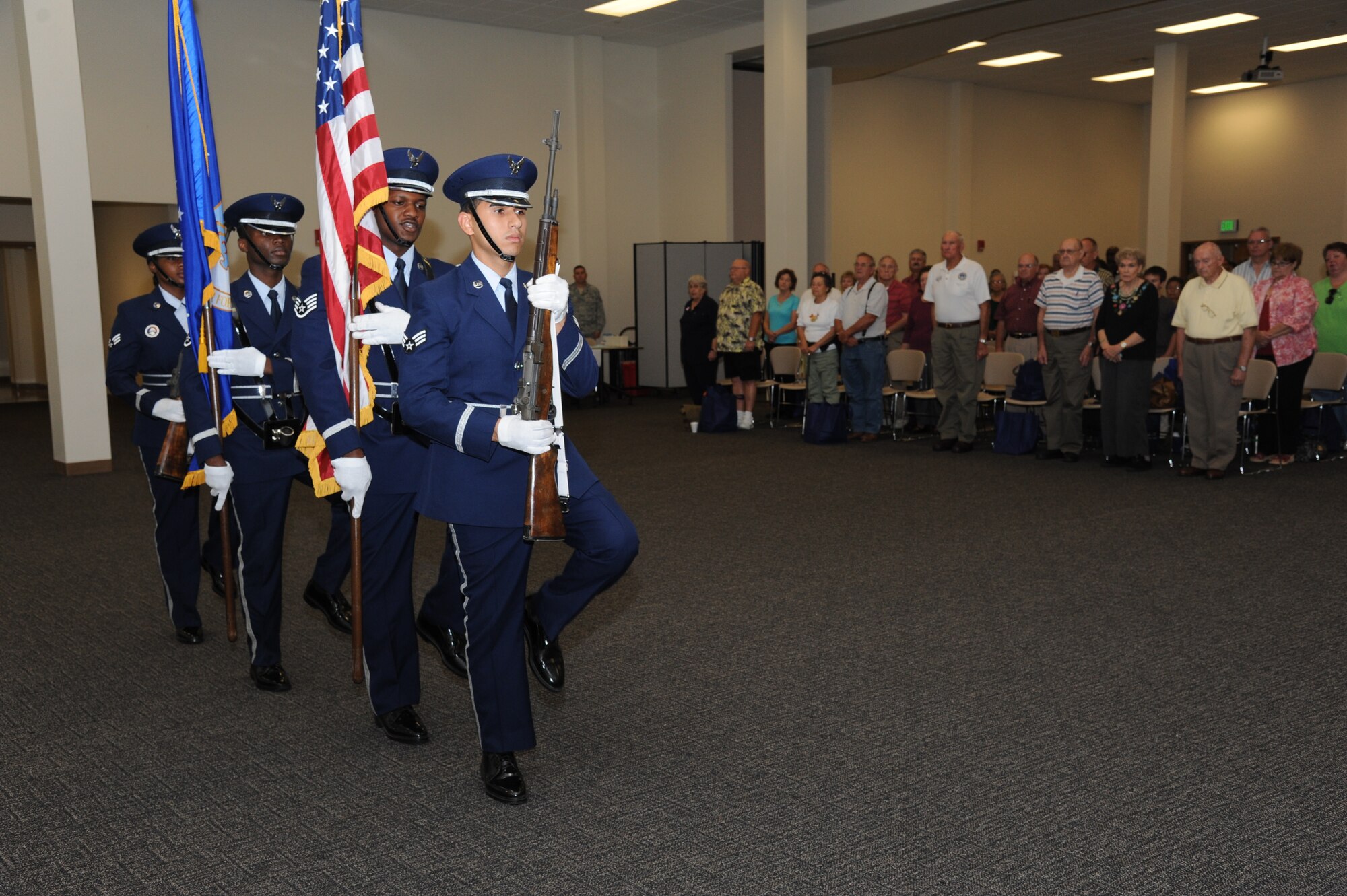 The Keesler Honor Guard post the colors for the singing of the National Anthem and reciting of the Pledge of Allegiance during the 81st Training Wing’s retiree appreciation day Oct. 12, 2012, at the Roberts Consolidated Aircraft Maintenance Facility, Keesler Air Force Base, Miss.  The event included information booths, guest speakers and lunch.  (U.S. Air Force photo by Kemberly Groue)