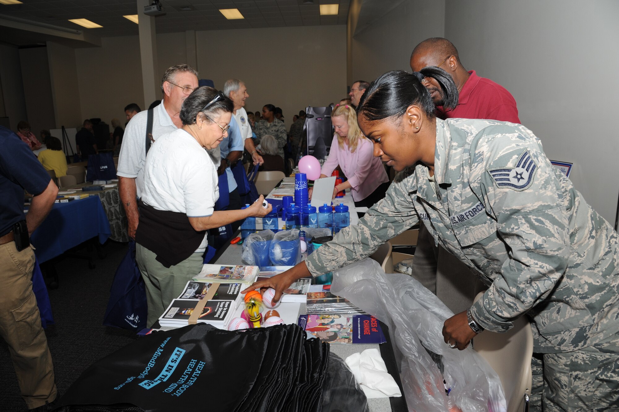 Staff Sgt. Kenyatta Curtis, 81st Medical Operations Squadron, sets up stress balls for retirees at the alcohol and drug awareness booth during the 81st Training Wing’s retiree appreciation day Oct. 12, 2012, at the Roberts Consolidated Aircraft Maintenance Facility, Keesler Air Force Base, Miss.  The event included information booths, guest speakers and lunch.  (U.S. Air Force photo by Kemberly Groue)