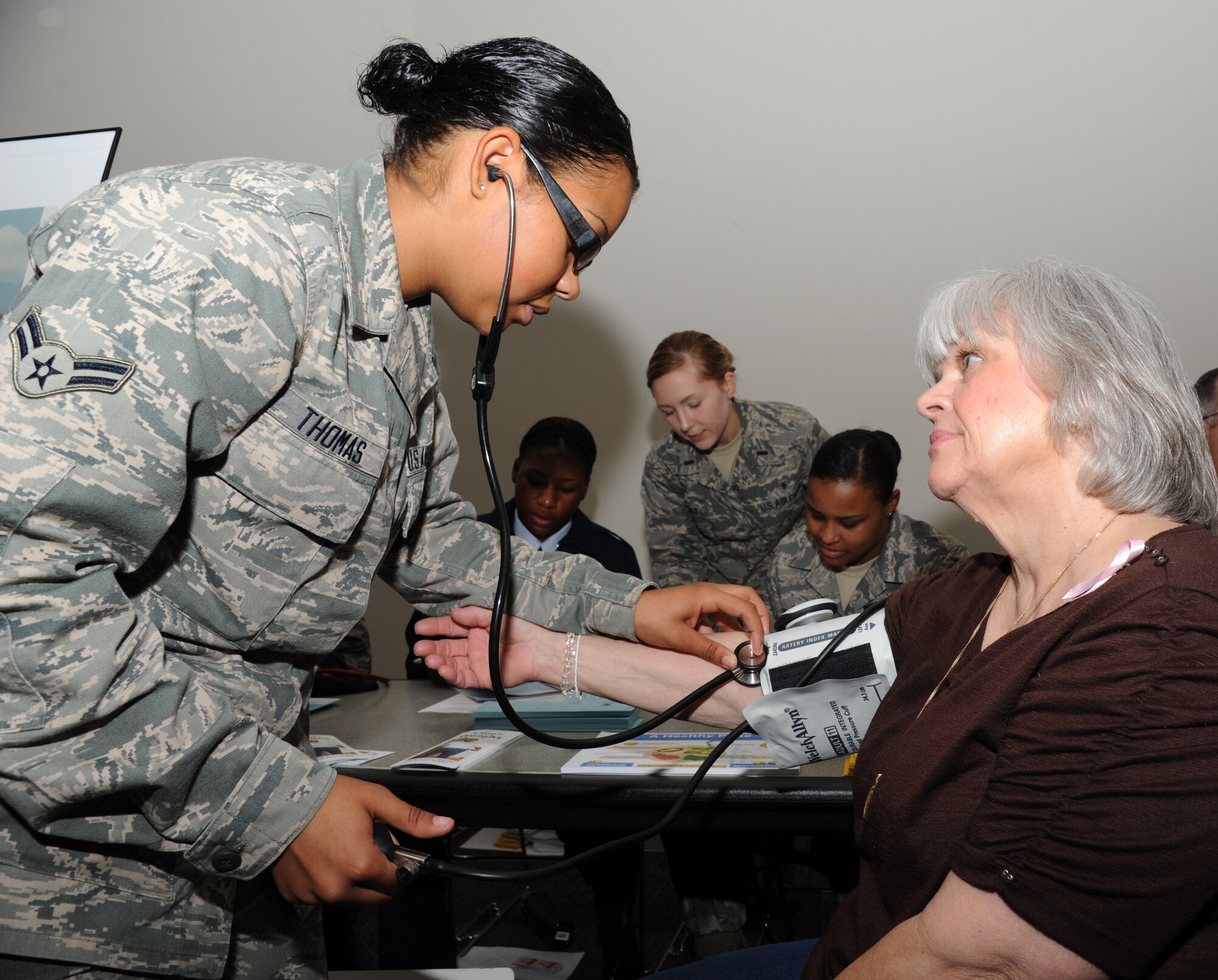 Airman 1st Class Ariel Thomas, 81st Medical Operations Squadron, checks blood pressure and provides information for preventive health to Patricia Governale, former spouse of retired Patrick Governale, of Ocean Springs, Miss., during the 81st Training Wing’s retiree appreciation day Oct. 12, 2012, at the Roberts Consolidated Aircraft Maintenance Facility, Keesler Air Force Base, Miss.  The event included information booths, guest speakers and lunch.  (U.S. Air Force photo by Kemberly Groue)