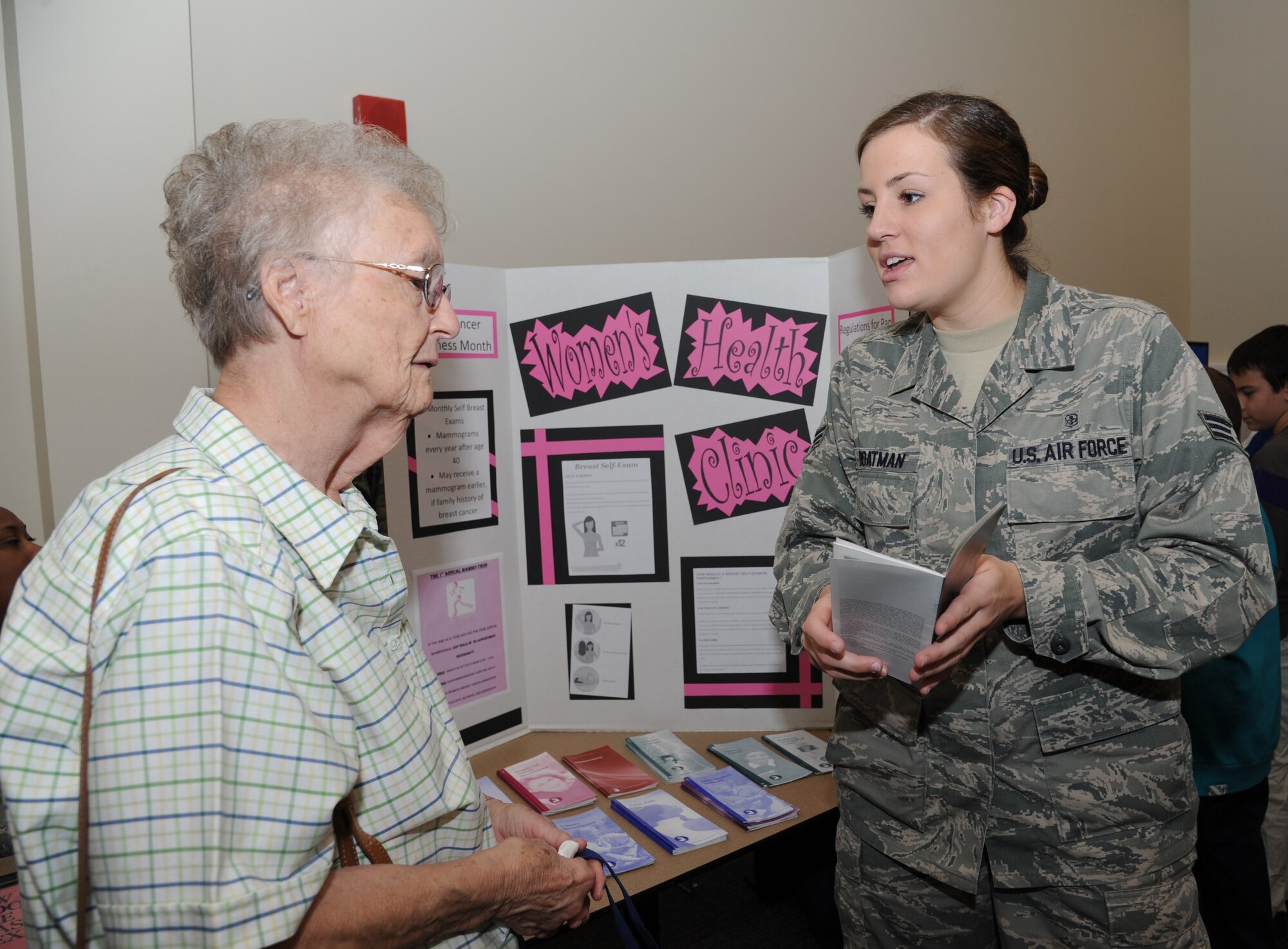 Alice Hill, spouse of retired Master Sgt. Billy Hill of St. Martin, Miss., receives information about the women’s health clinic from Senior Airman Stephanie Boatman, 81st Surgical Operations Squadron, during the 81st Training Wing’s retiree appreciation day Oct. 12, 2012, at the Roberts Consolidated Aircraft Maintenance Facility, Keesler Air Force Base, Miss.  The event included information booths, guest speakers and lunch.  (U.S. Air Force photo by Kemberly Groue)
