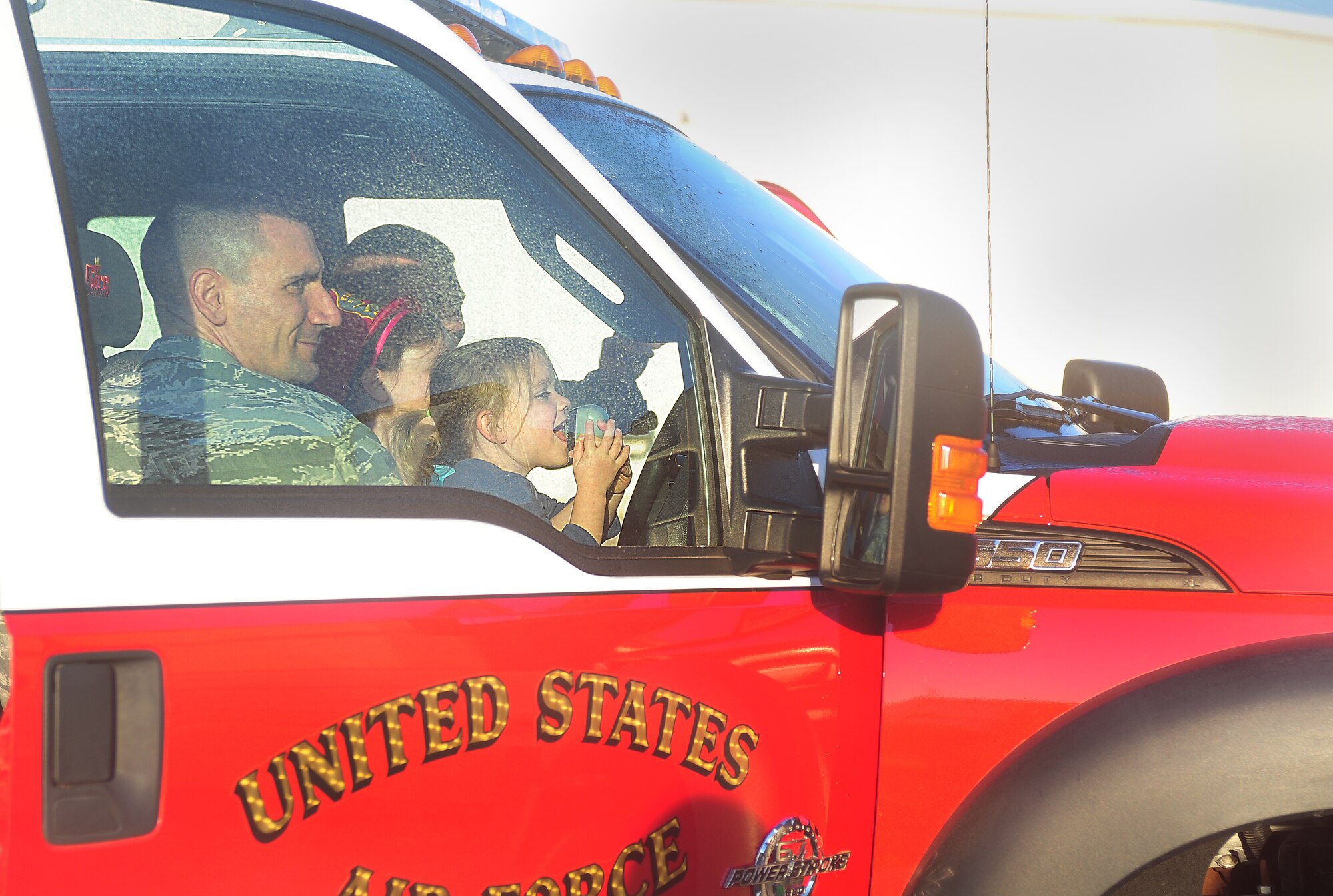 U.S. Air Force Lt. Col. Anthony Figiera, 27th Special Operations Civil Engineer Squadron commander, and his family enjoy the firefighter’s open house at Cannon Air Force Base, N.M., Oct. 10, 2012. Fire Prevention Week is an annual event that is dedicated to spreading fire prevention techniques to the community and thanking those who serve and protect. (U.S. Air Force photo/Airman 1st Class Ericka Engblom)