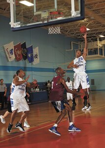 Joint Base San Antonio-Lackland Warhawks forward Ty Moore takes it to the hoop during the team’s 92-80 preseason loss to JBSA-Fort Sam Houston Oct. 3 at the JBSA-Lackland Chaparral Fitness Center. (U.S. Air Force photo/Robbin Cresswell)