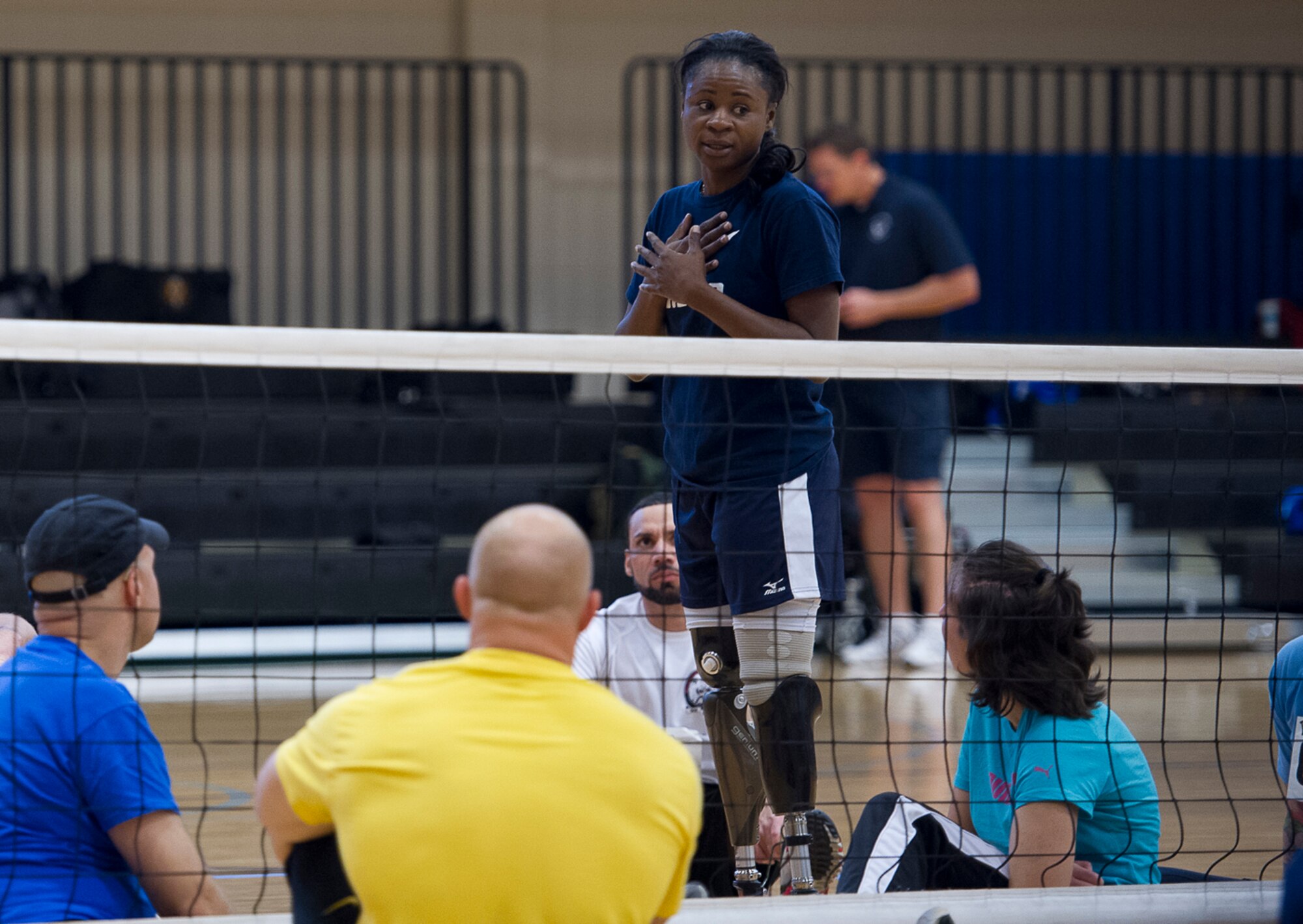*Teaching the fundamentals of sitting volleyball at the Rambler Fitness Center, Randolph Air Force Base, Texas, Jan. 18, Miller embraces the opportunity to meet, coach and mentor wounded, injured and ill warriors participating in a Paralympic military sports camp. Even though she was in the Army, Miller has a soft spot for the Air Force as her younger brother, Michael Miller, served as an F-16 crew chief at Cannon AFB, N.M. (Photo by Tech. Sgt. Samuel Bendet)
