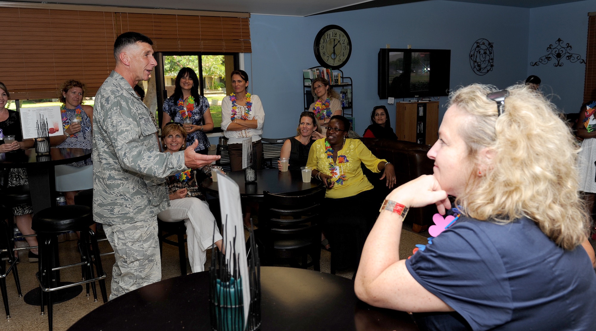 Lt. Col. Anthony Deichert, chief of chaplains, briefs the Gathering Place mission and purpose to spouses from the foreign Air Attaché Association, at the Gathering Place, a comfortable alcohol- and smoke-free home-like environment where young Airmen can socialize with their peers at the Hickam dormitories, Joint Base Pearl Harbor-Hickam, Hawaii, Oct. 9, 2012. Lt. Gen. Frank Gorenc, U.S. Air Force assistant vice chief of staff, hosted the tour which is meant to showcase how the U.S. Air Force conducts business.  The tour for the spouses highlighted how PACAF houses its forces, develops Airmen’s dependent children and cares for wounded members, common topics among the world’s militaries. (U.S. Air Force Photo/Tech. Sgt. Jerome S. Tayborn/Released)