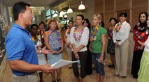 Benny Miguel, Pearl Harbor Fitness Center manager, gives a guided tour to foreign attaché corps spouses, at the Pearl Harbor Fitness Center, Joint Base Pearl Harbor-Hickam, Hawaii, Oct. 9, 2012. Lt. Gen. Frank Gorenc, U.S. Air Force assistant vice chief of staff, hosted the tour which is meant to showcase how the U.S. Air Force conducts business.  The tour for the spouses highlighted how PACAF houses its forces, develops Airmen’s dependent children and cares for wounded members, common topics among the world’s militaries. (U.S. Air Force Photo/Tech. Sgt. Jerome S. Tayborn/Released)