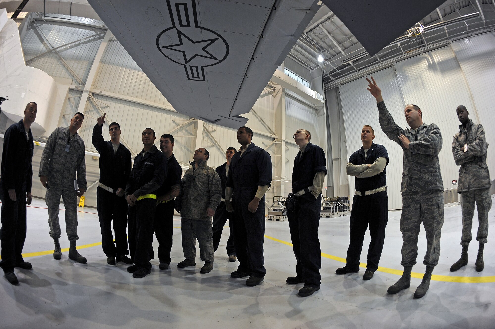 U.S. Air Force Airmen from the 4th Fighter and 916th Air Refueling Wings examine and discuss parts of a KC-135R Stratotanker on Seymour Johnson Air Force Base, N.C., Oct. 9, 2012. Crash recovery Airmen from the wings came together and held a joint-operation training session to prepare for possible aircraft mishaps. (U.S. Air Force photo/Airman 1st Class John Nieves Camacho/Released)