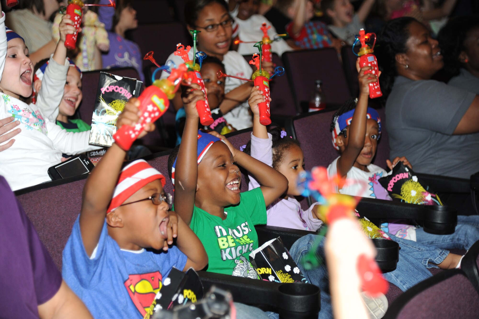 Children cheer as Sesame Street characters arrive on stage during the Sesame Street/USO Experience for Military Families show Oct. 9, 2012 at the Welch Theater, Keesler Air Force Base, Miss.  The 45-minute family-oriented event hosted by the 81st Force Support Squadron includes a character named Katie who is a military child.  With the help of her Sesame pals, Katie learns to deal with her fears and excitement about relocating.  The show emphasizes the importance of adjusting to change and the power of friendship.  (U.S. Air Force photo by Kemberly Groue)