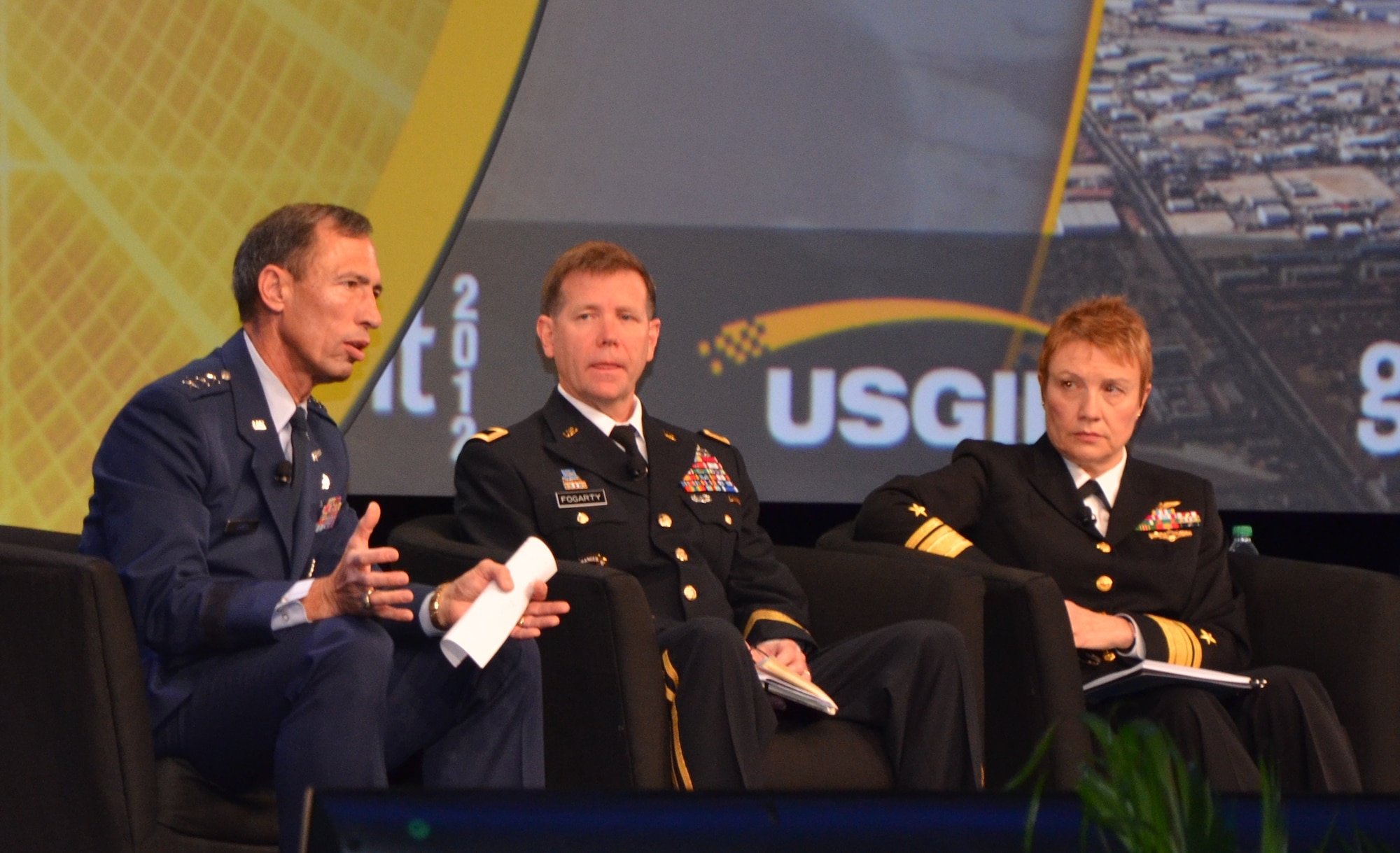 ORLANDO, Fla. -- Lt. Gen. Larry James (left) addresses attendees at the 2012 GEOINT Symposium, Oct. 11 here. James, the Air Force deputy chief of Intelligence, Surveillance and Reconnaissance, was joined by Maj. Gen. Steve Fogarty (center), commanding general of U.S. Army Intelligence and Security Command; Rear Adm. Sandy Daniels (right), Senior Advisor for Space to the Deputy Chief of Naval Operations for Information Dominance and Phillip C. Chuboda (not pictured), assistant director of intelligence for the U.S. Marine Corps. (U.S. Air Force photo by Susan A. Romano)
