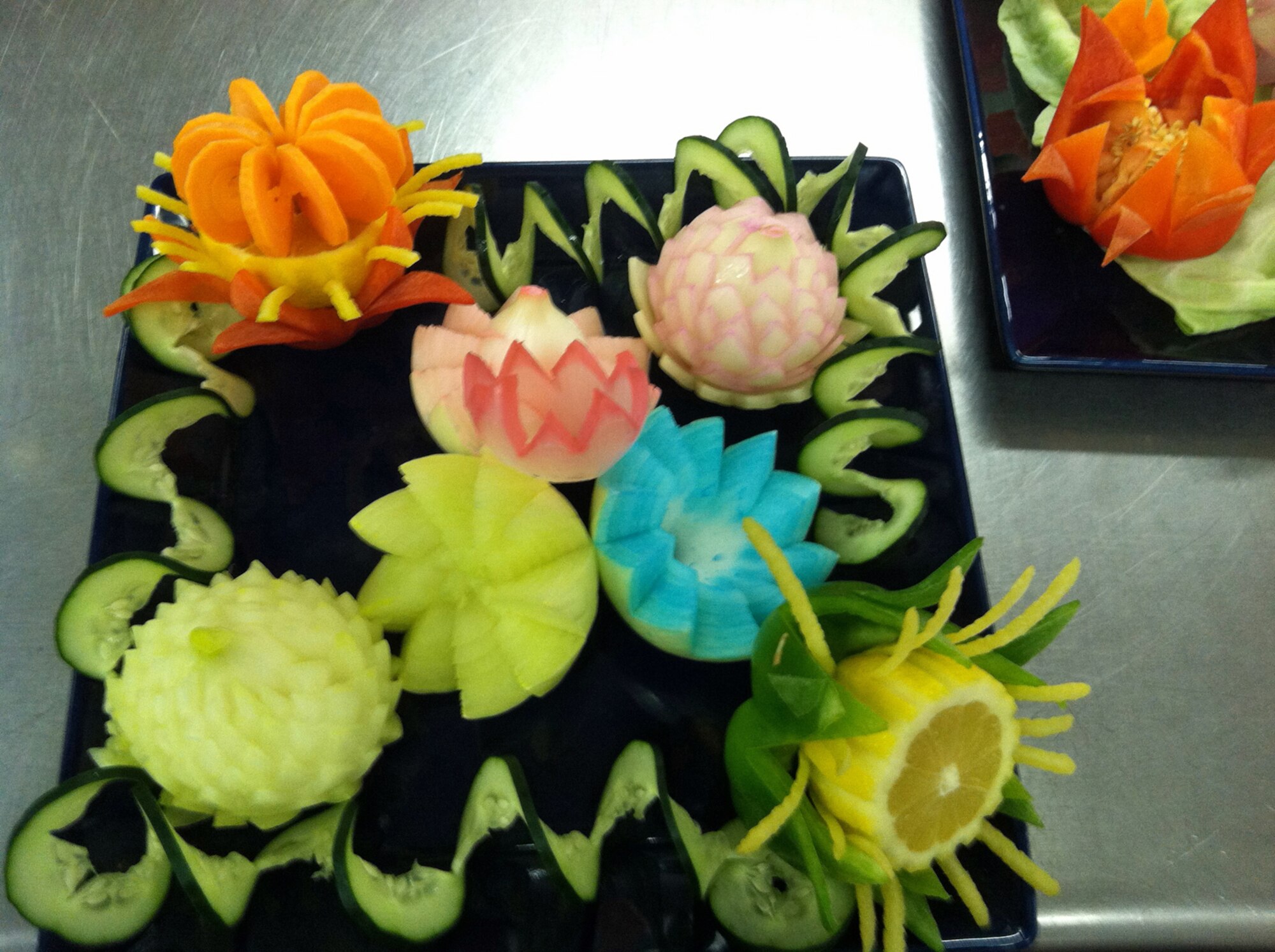 Staff Sgt. Joshua Pallardy, evening shift supervisor at the Aragon Dining Facility, believes something as simple as cutting vegetables differently, as he did in a recent knife cutting demo, cues the brain to think the food tastes different.