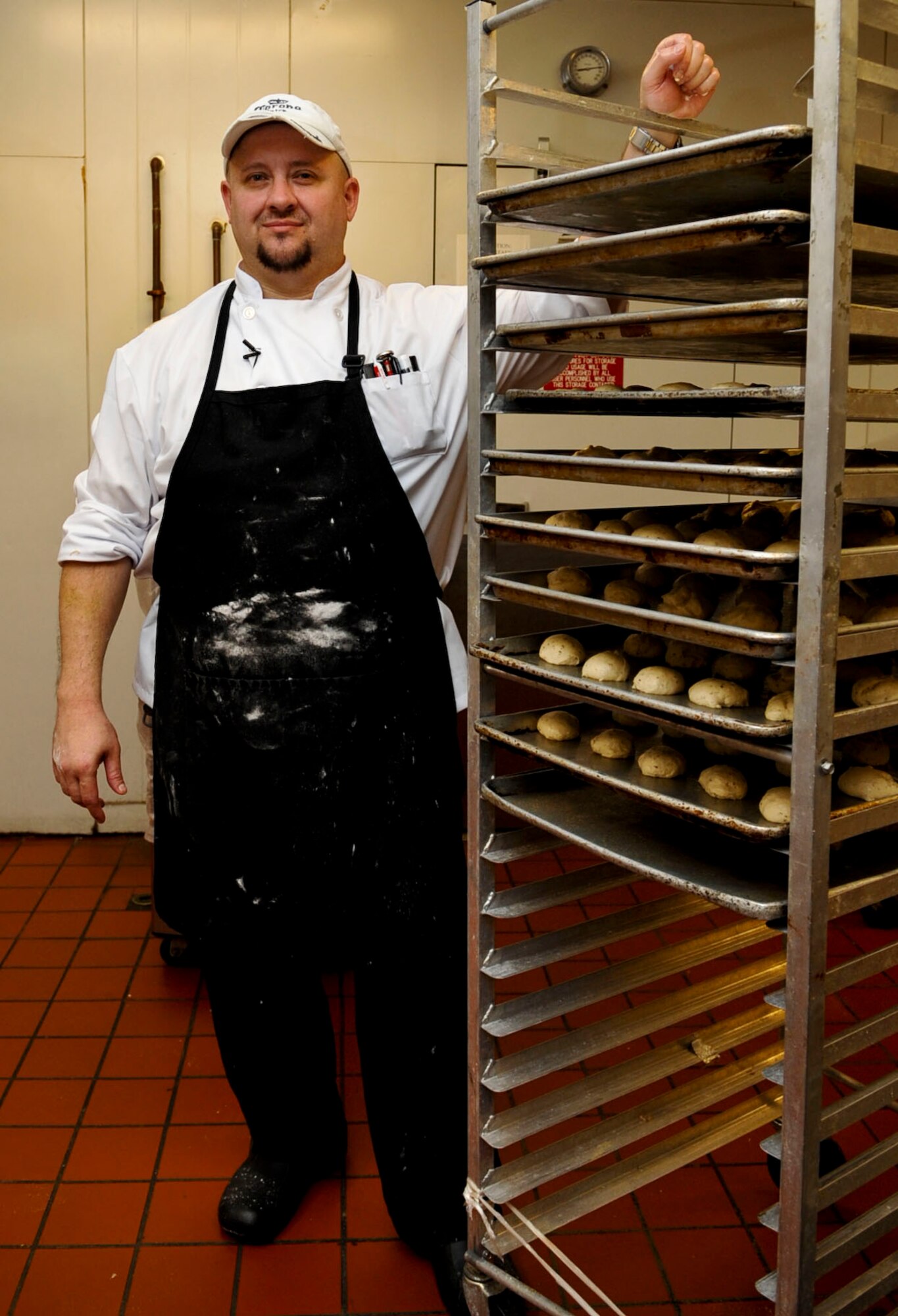 Tim Cooper, Fort Eustis Club executive chef, showcases his freshly made rolls in the club's kitchen at Fort Eustis, Va., Oct. 10, 2012. Cooper came to the club in July, bringing more than 20 years experience and more than 300 different recipes to improve the dining experience for the club's patrons. (U.S. Air Force photo by Staff Sgt. Wesley Farnsworth/ Released)