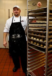 Tim Cooper, Fort Eustis Club executive chef, showcases his freshly made rolls in the club's kitchen at Fort Eustis, Va., Oct. 10, 2012. Cooper came to the club in July, bringing more than 20 years experience and more than 300 different recipes to improve the dining experience for the club's patrons. (U.S. Air Force photo by Staff Sgt. Wesley Farnsworth/ Released)