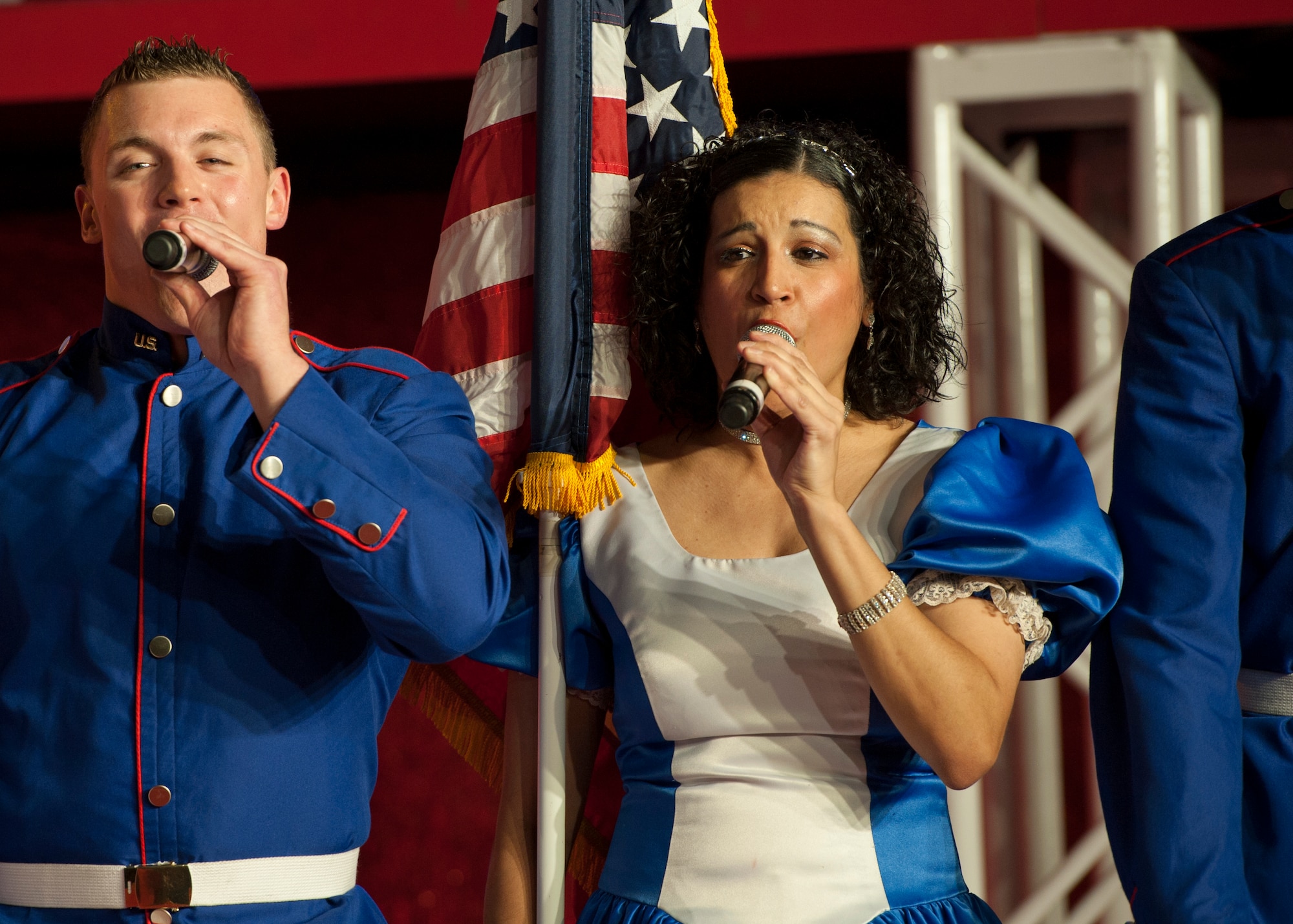 Staff Sgt. Abigail Foster, 92nd Maintenance Squadron and former Tops in Blue vocalist, sings at the 2011 tour "Rhythm Nation." Foster overcame brain surgery prior to joining the entertainment group. Tops in Blue performs nearly 150 shows, with 25 to 30 of them at deployed locations. (U.S. Air Force photos by Staff Sgt. Michael Means)