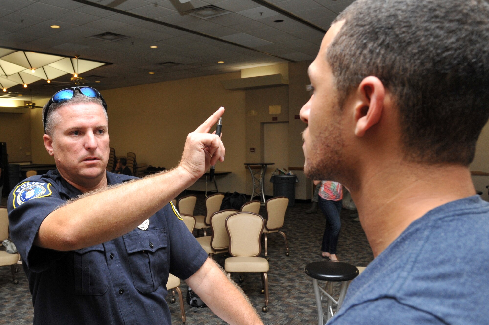 Joe Larson, 56th Security Forces Squadron Department of the Air Force police officer, performs a horizontal gaze nystagmus test on Senior Airman Earl Nelson, Component Maintenance Squadron aerospace propulsion technician, Sept. 28 during a driving under the influence enforcement training course.   (U.S. Air Force photo by Senior Airman Sandra Welch)