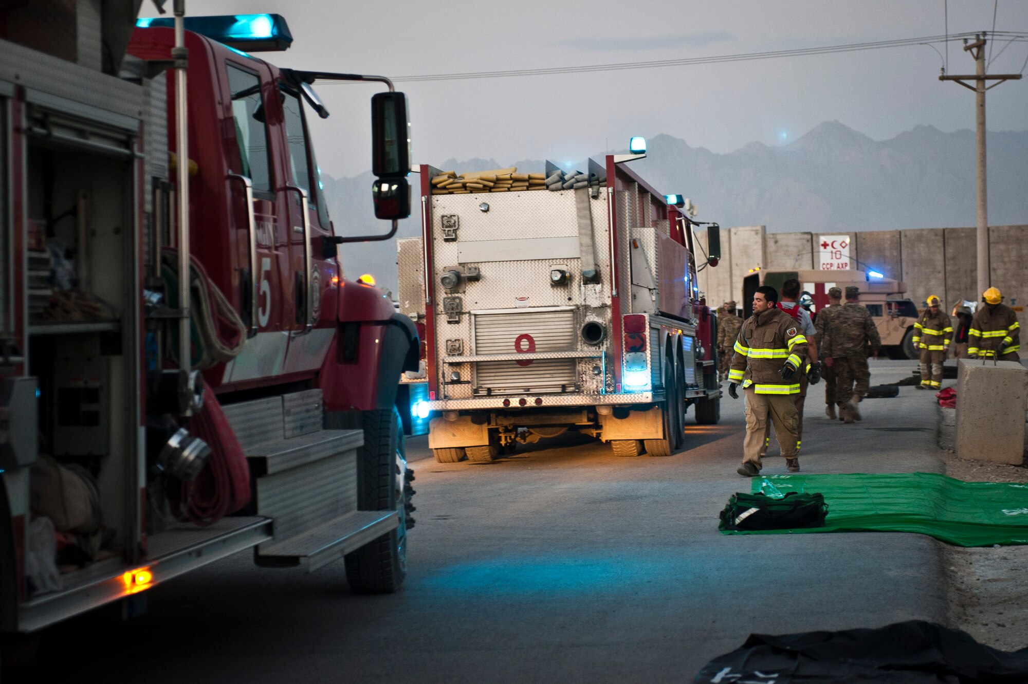 Firefighters respond to a simulated massive casualty event during an emergency response exercise at Bagram Airfield, Afghanistan, Oct. 12, 2012. The exercise was designed to test Bagram’s first responders and emergency managers in order to maintain readiness for potential real-world crises on base. (U.S. Air Force photo/Capt. Raymond Geoffroy)