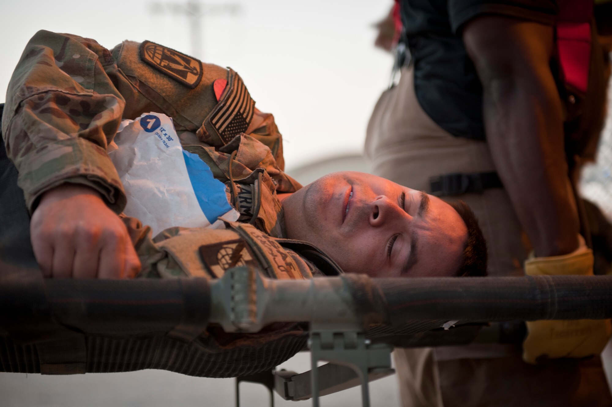 A “wounded” soldier is loaded onto an ambulance during an emergency response exercise at Bagram Airfield, Afghanistan, Oct. 12, 2012. The exercise was designed to test Bagram’s first responders and emergency managers in order to maintain readiness for potential real-world crises on base. (U.S. Air Force photo/Capt. Raymond Geoffroy)