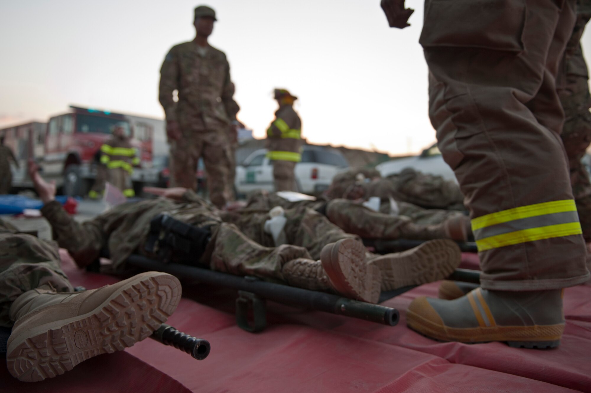 “Wounded” base personnel await transport at a casualty collection point during an emergency response exercise at Bagram Airfield, Afghanistan, Oct. 12, 2012. Exercises like this ensure Bagram is well postured to respond to real-world attacks, disasters and other crises. (U.S. Air Force photo/Capt. Raymond Geoffroy)