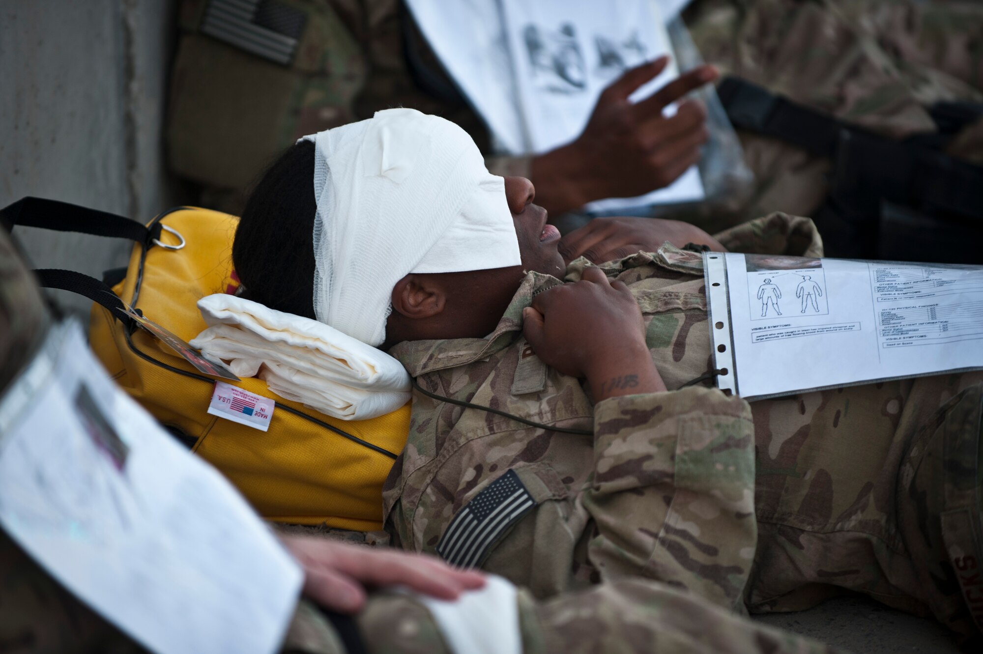 A “wounded” Airman lies at a casualty collection point during an emergency response exercise at Bagram Airfield, Afghanistan, Oct. 12, 2012. Exercises like this ensure Bagram is well postured to respond to real-world attacks, disasters and other crises. (U.S. Air Force photo/Capt. Raymond Geoffroy)