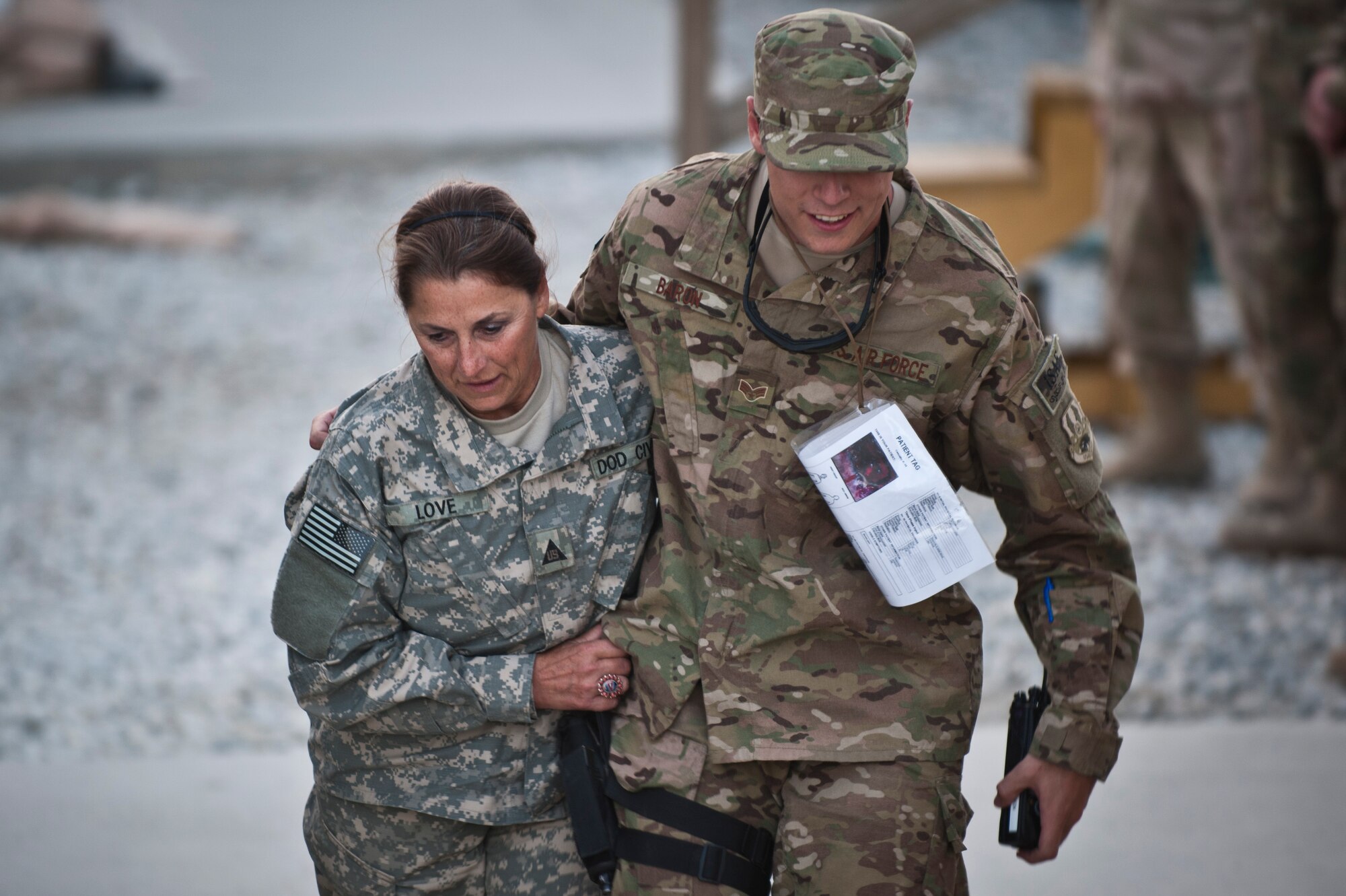 Role-players evacuate a dining facility during an emergency response exercise at Bagram Airfield, Afghanistan, Oct. 12, 2012. Bagram emergency crews responded to a simulated massive casualty event involving dozens of volunteers experiencing a wide range of simulated injuries. (U.S. Air Force photo/Capt. Raymond Geoffroy) 