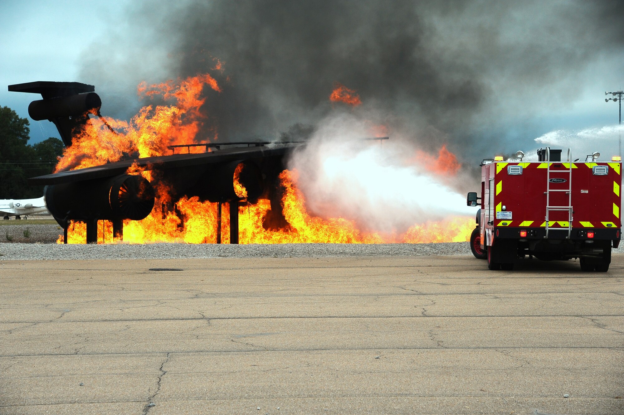 A Rapid Intervention Vehicle showcases the efficiency and speed at which it can put out an aircraft fire during a live burn Oct. 6 as a part of the Fire Prevention Week kick-off.  The theme of the 2012 Fire Prevention Week is “Have 2 Ways Out” which urges parents and children to know and plan multiple exits from their homes in case of a fire.  (U.S. Air Force Photo/Airman 1st Class Charles Dickens)