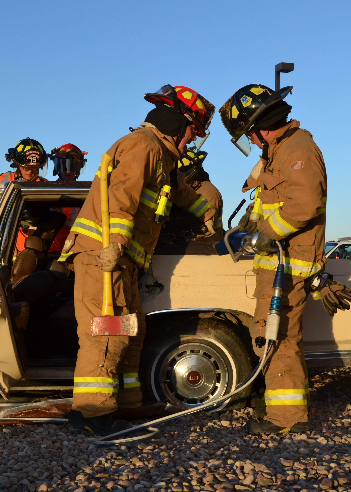 Malmstrom fire fighters demonstrate an auto extrication for spectators at the Exchange on Oct. 9.  During this demonstration, they showed those in attendance how they would get someone out of a vehicle using the jaws of life and other power tools.  (U.S. Air Force photo/Airman 1st Class Cortney Paxton)