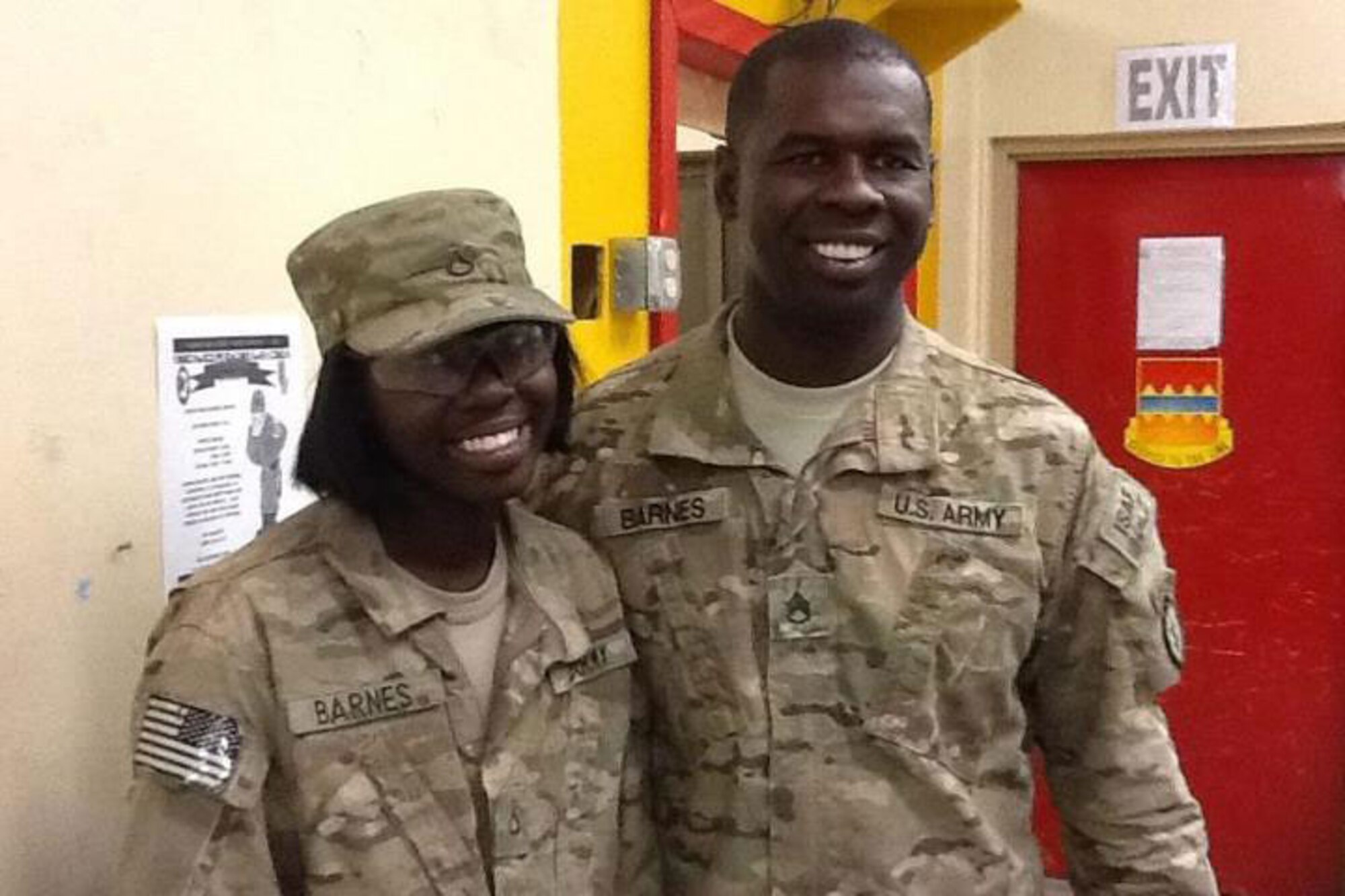 Spartan Soldiers Pfc. Maeyamonique Barnes and her father, Army Staff Sgt. Albert Barnes, enjoy a moment together during their deployment. (Courtesy photo)