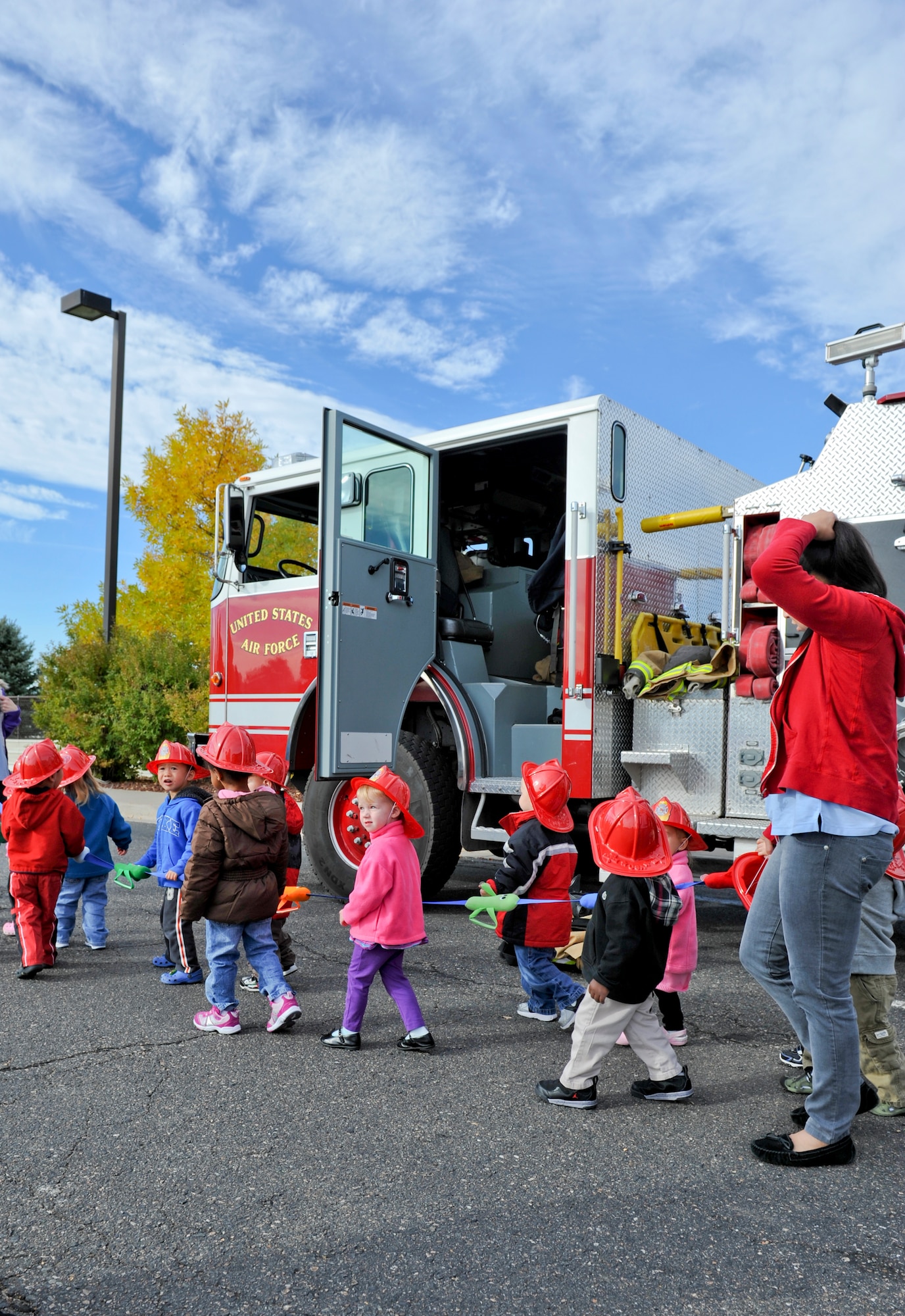 BUCKLEY AIR FORCE BASE, Colo. – Children from a Buckley Child Development Center check out a Buckley Fire Department fire truck Oct. 11, 2012, at the CDC. Children learned when to dial 911, to have at least two ways to exit a room in case of a fire and several other tips in effort to promote Fire Prevention Week. (U.S. Air Force photo by Senior Airman Christopher Gross)