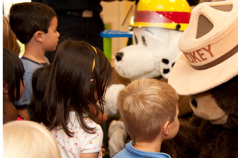 VANDENBERG AIR FORCE BASE, Calif. – Smokey the Bear and Sparky, Vandenberg Fire Departments mascot, visit the children at the Child Development Center here Wednesday, Oct. 10, 2012. The mascots visited the CDC to kick-off Fire Prevention Week. FPW has events scheduled daily until Friday, October 13. (U.S. Air Force photo/Senior Airman Lael Huss)