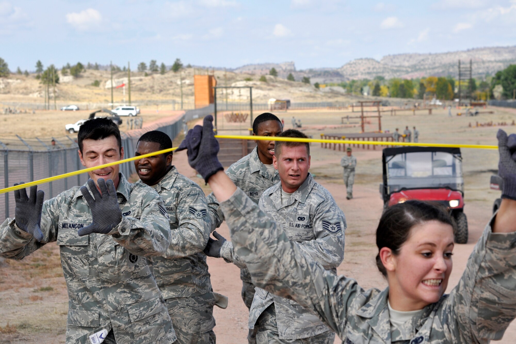 Members of the 307th Security Forces Squadron from Barksdale Air Force Base, La., finish the obstacle course at Camp Guernsey, Wyo., Sept. 27, 2012. They were competing in the 2012 annual Global Strike Challenge. A team of six Airmen and one alternate were allowed to compete from missile and bomb wings throughout the Air Force Global Strike Command. (U.S. Air Force photo by Col. Kevin Wolfe/Released) 