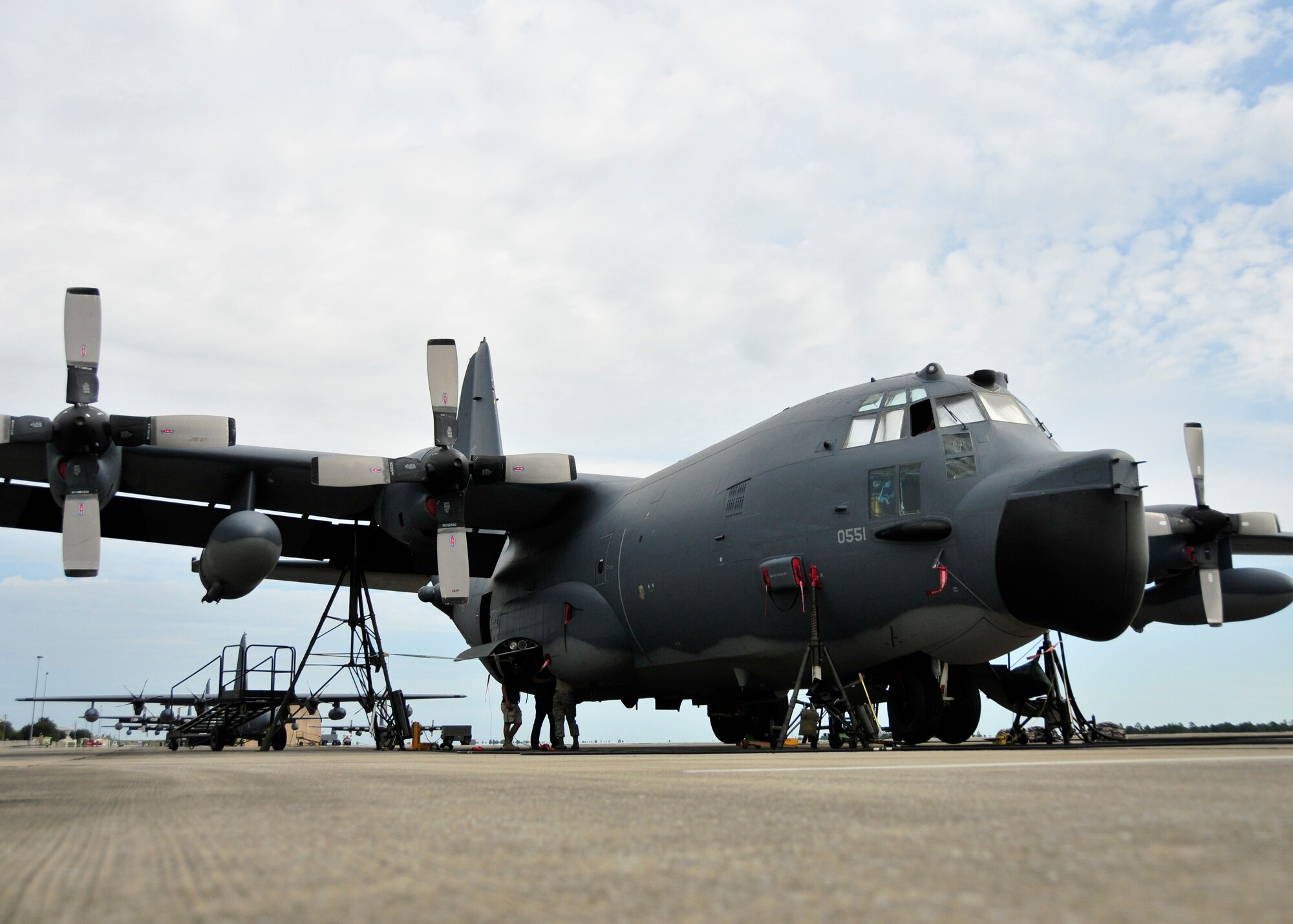 After using jacks to raise an MC-130E aircraft at Duke Field, Fla., members of the 919th Aircraft Maintenance Squadron perform a time compliance technical order inspection on one of its main landing gear assemblies.  The 919th Special Operations Wing has retired about half of its MC-130 fleet as it moves toward a new aviation foreign internal defense mission.  (U.S. Air Force photo/Tech. Sgt Cheryl Foster) 