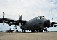 After using jacks to raise an MC-130E aircraft at Duke Field, Fla., members of the 919th Aircraft Maintenance Squadron perform a time compliance technical order inspection on one of its main landing gear assemblies.  The 919th Special Operations Wing has retired about half of its MC-130 fleet as it moves toward a new aviation foreign internal defense mission.  (U.S. Air Force photo/Tech. Sgt Cheryl Foster) 