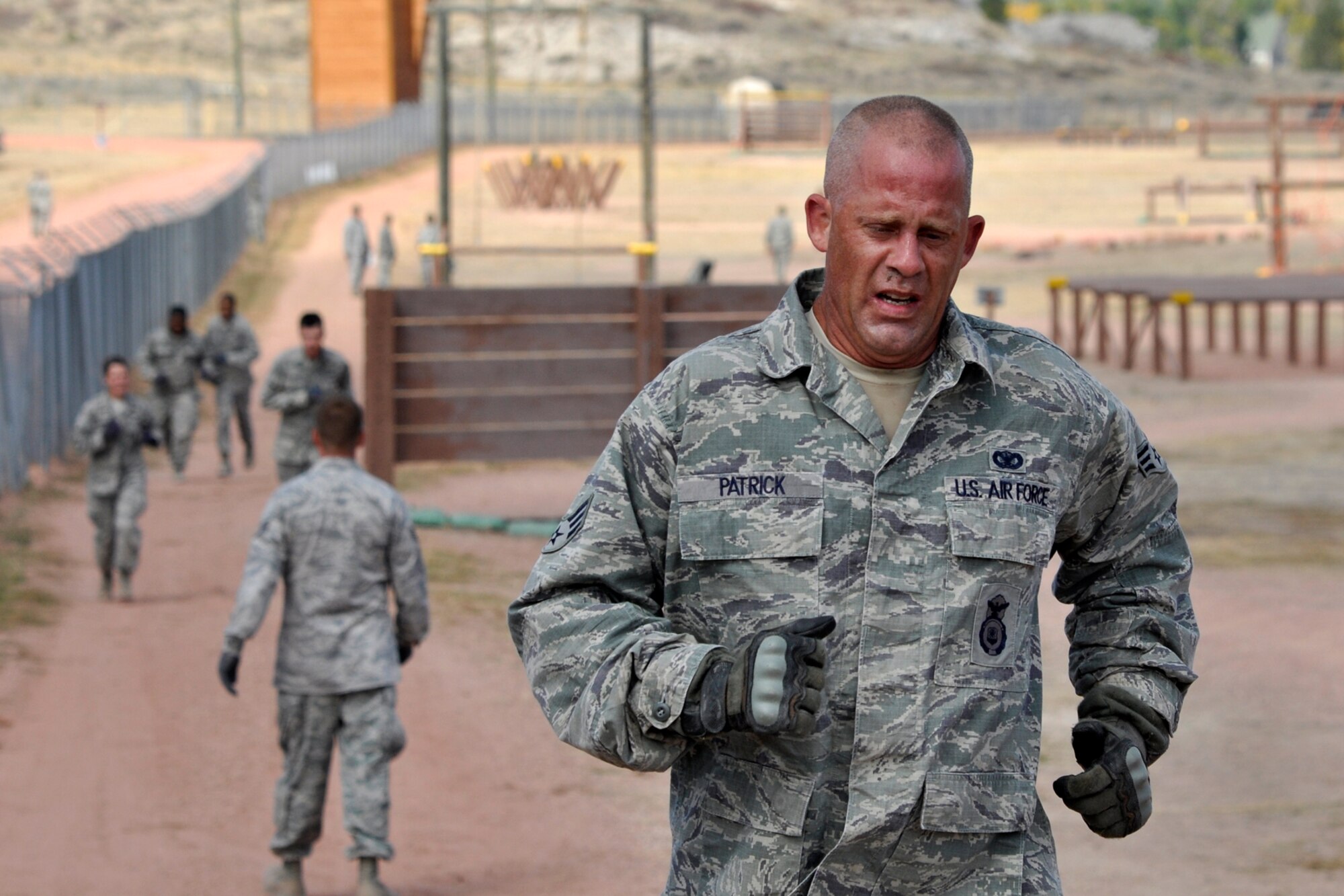 Senior Airman Randy Patrick, a 307th Security Forces Squadron journeyman from Barksdale Air Force base, La., finishes the obstacle course at Camp Guernsey, Wyo., Sept. 27, 2012. Patrick was competing in the 2012 annual Global Strike Challenge. A team of six Airmen and one alternate were allowed to compete from missile and bomb wings throughout the Air Force Global Strike Command. (U.S. Air Force photo by Col. Kevin Wolfe/Released) 