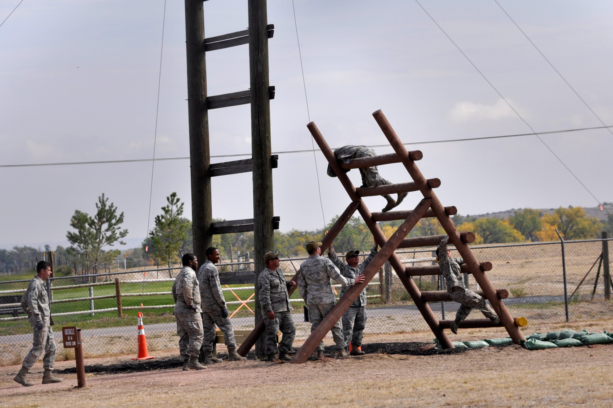 Members of the 307th Security Forces Squadron from Barksdale Air Force Base, La., attack the obstacle course at Camp Guernsey, Wyo., Sept. 27, 2012. They were competing in the 2012 annual Global Strike Challenge. A team of six Airmen and one alternate were allowed to compete from missile and bomb wings throughout the Air Force Global Strike Command. (U.S. Air Force photo by Col. Kevin Wolfe/Released) 