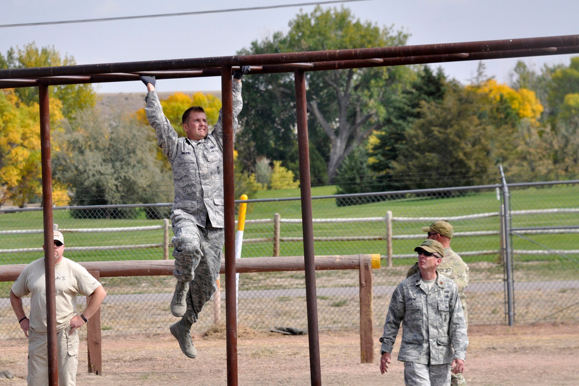 Staff Sgt. Johnathan Maupin, a 307th Security Forces Squadron journeyman from Barksdale Air Force Base, La., makes his way across the monkey bars in an obstacle course at Camp Guernsey, Wyo., Sept. 27, 2012. Maupin was competing in the 2012 annual Global Strike Challenge. A team of six Airmen and one alternate were allowed to compete from missile and bomb wings throughout the Air Force Global Strike Command. (U.S. Air Force photo by Col. Kevin Wolfe/Released) 