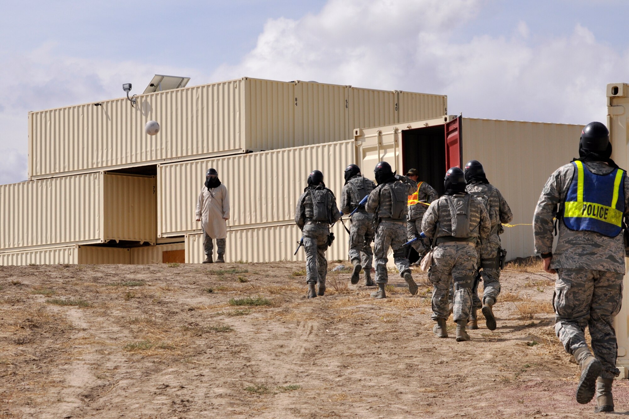 Members of the 307th Security Forces Squadron team from Barksdale Air Force Base, La., make their way to the location where they will attempt to clear several buildings at Camp Guernsey, Wyo., Sept. 26. 2012. The team was competing in the tactics portion of the 2012 annual Global Strike Challenge. A team of six Airmen and one alternate were allowed to compete from missile and bomb wings throughout the Air Force Global Strike Command. (U.S. Air Force photo by Col. Kevin Wolfe/Released) 