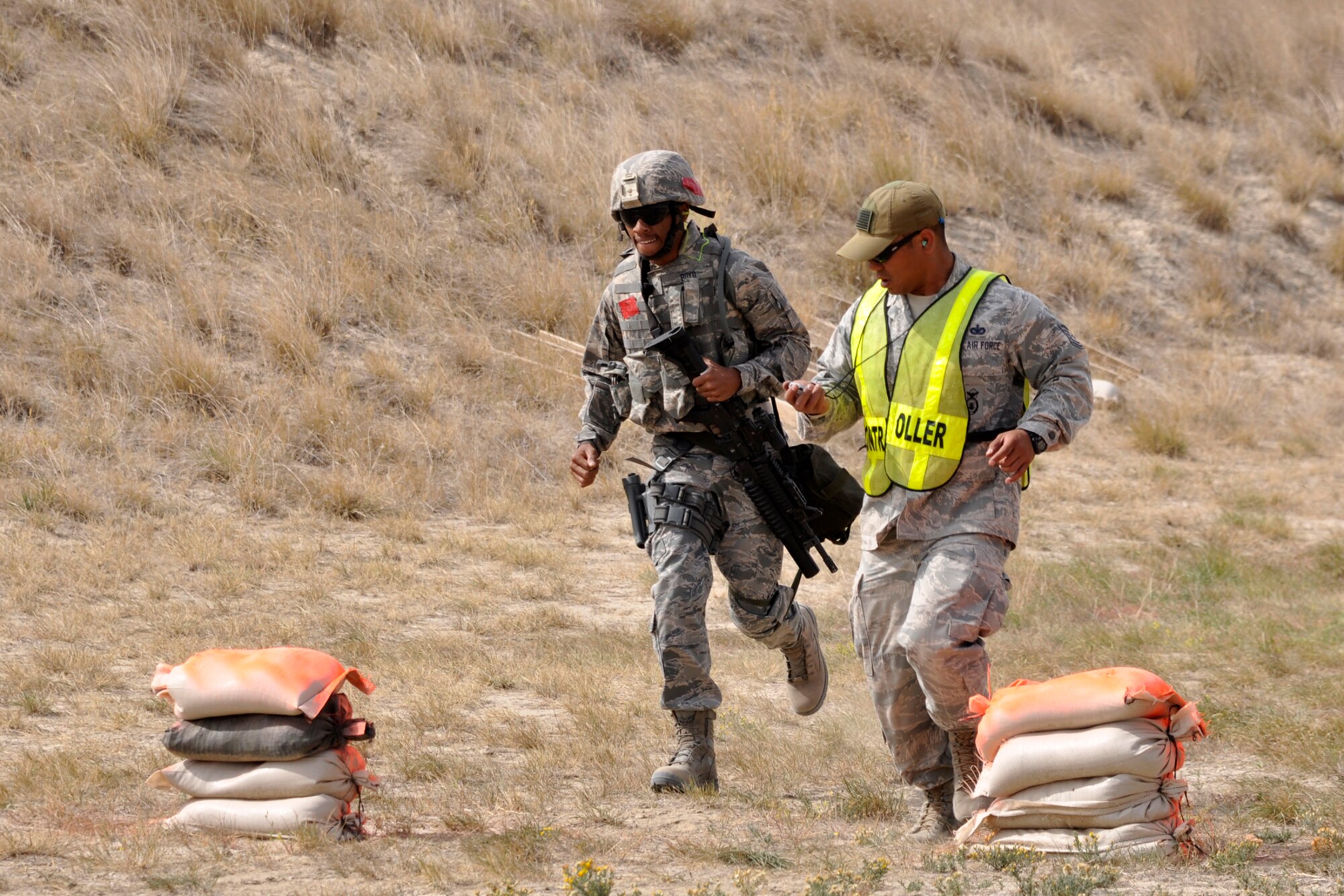 Senior Airman Stephen D. Boyd Jr., a 307th Security Forces Squadron journeyman from Barksdale Air Force Base, La., runs the M-9 pistol course at Camp Guernsey, Wyo., Sept. 25. 2012. Boyd was part of the 307 SFS team competing in the 2012 annual Global Strike Challenge. A team of six Airmen and one alternate were allowed to compete from missile and bomb wings throughout the Air Force Global Strike Command. (U.S. Air Force photo by Col. Kevin Wolfe/Released) 