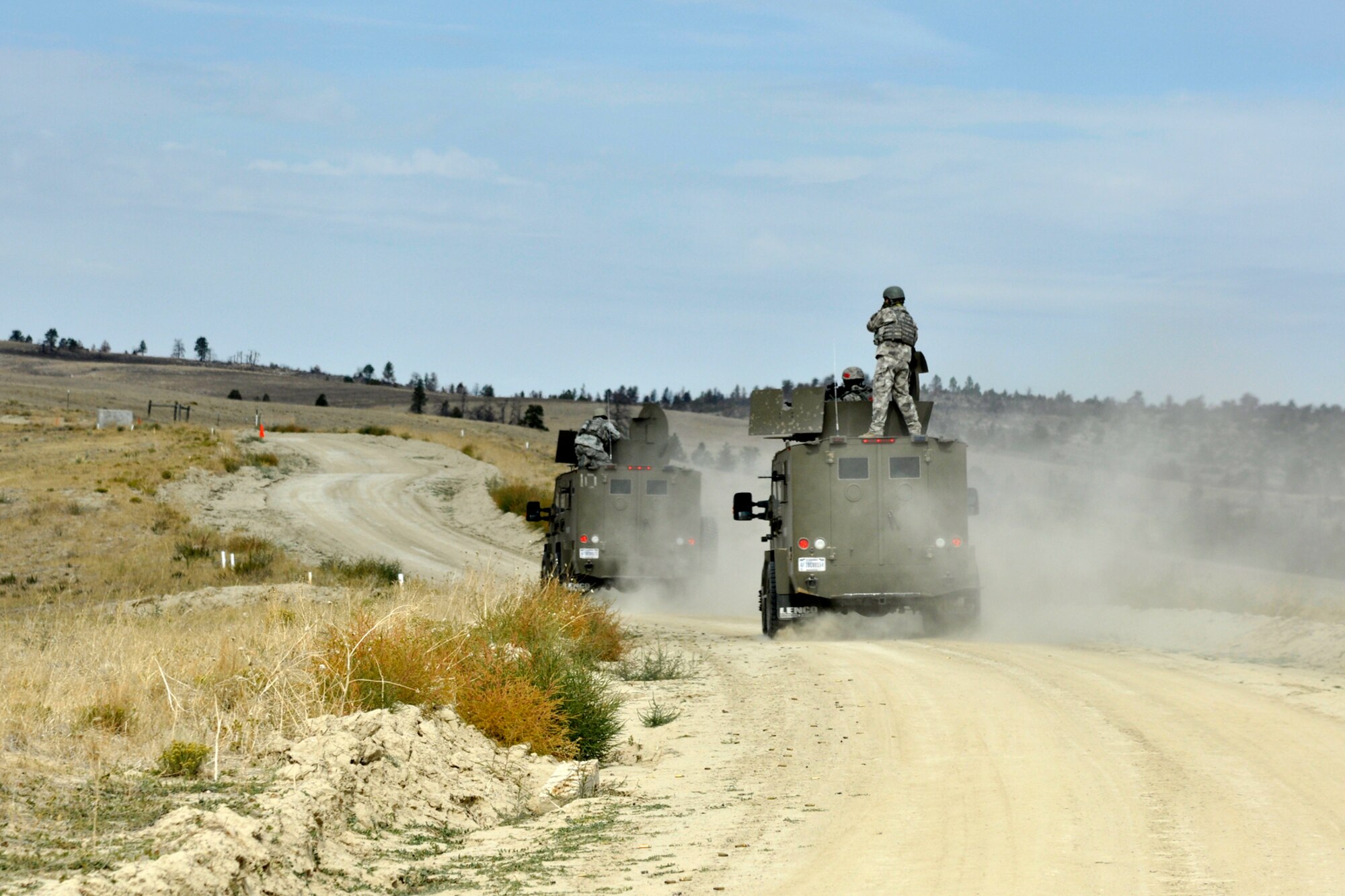 Members of the 307th Security Forces Squadron, Barksdale Air Force Base, La., display their skills using the M-240 Machine Gun on pop-up targets during the Global Strike Challenge at Camp Guernsey, Wyo., Sept. 25. 2012. The M-240 is a ground-mounted gas-operated crew-served machine gun. This reliable 7.62mm machine gun delivers more energy to a target than the smaller caliber M-249 Squad Automatic Weapon (SAW). (U.S. Air Force photo by Col. Kevin Wolfe/Released) 